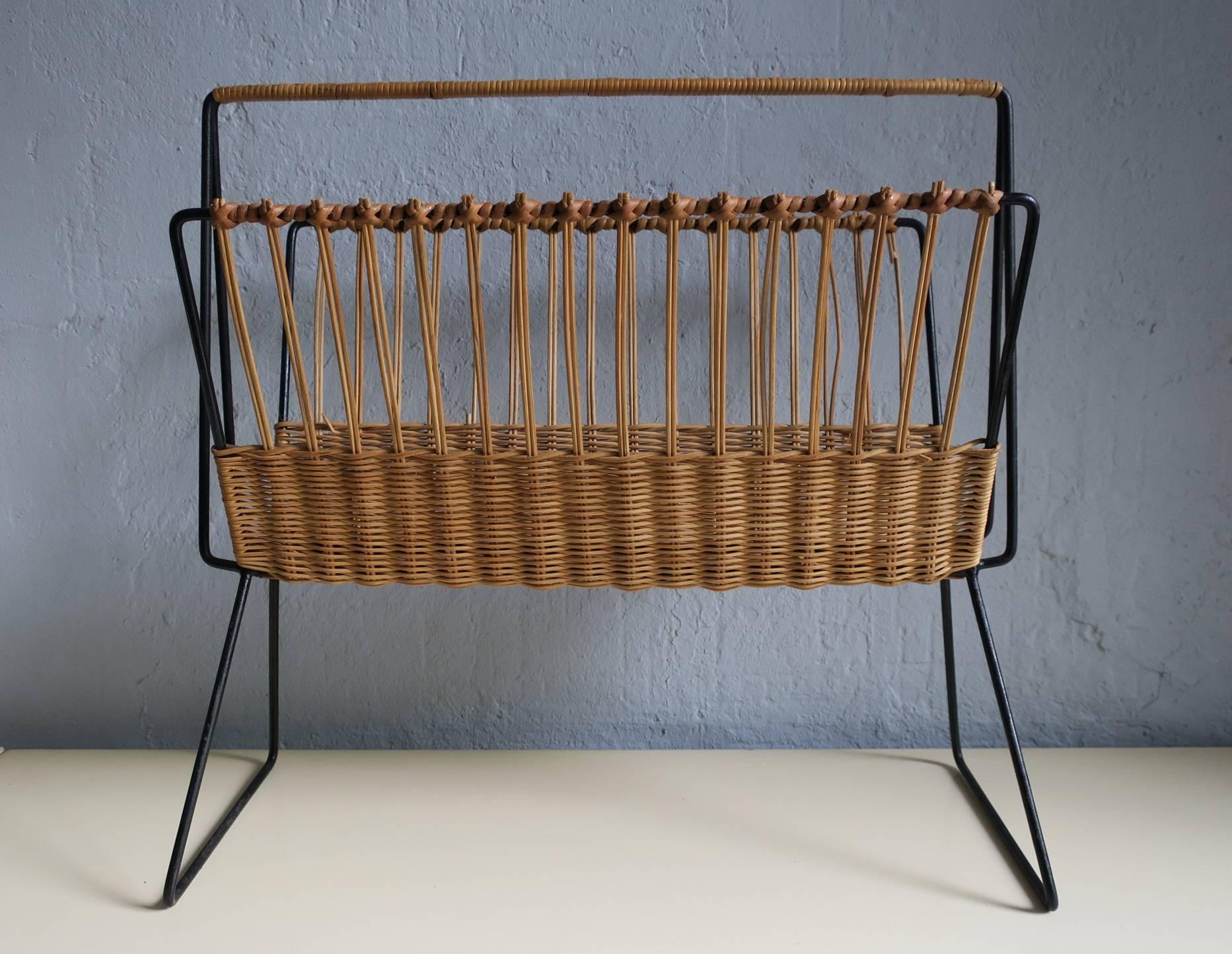 Mid-Century rattan and black painted metal magazine rack.