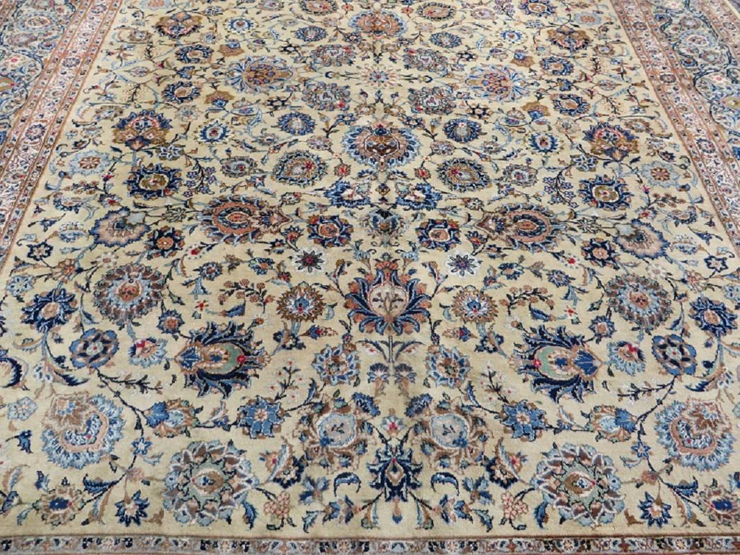 Large vintage Persian Kashan carpet in very good condition. With its all-over design on a light pistachio backround it's a good piece for modern interiors.