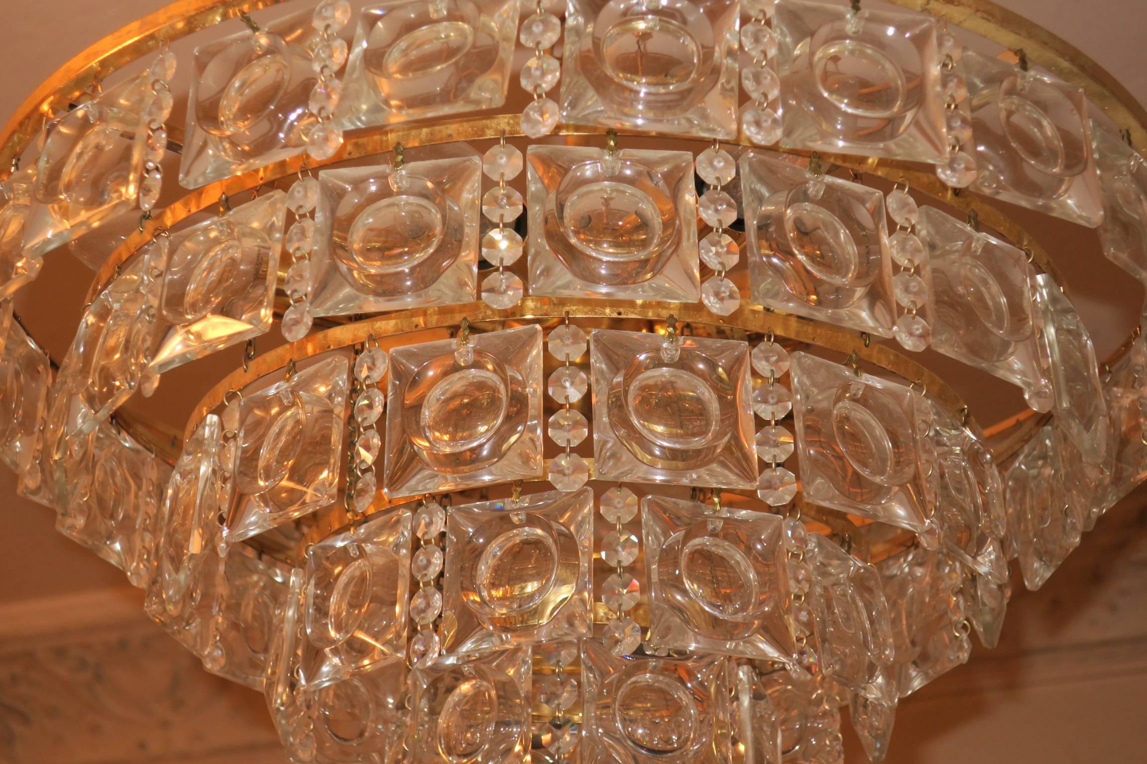 Kalmar gilt and glass chandelier from Austria Mid-Century, with eight lights and the original gilt ceiling cap.