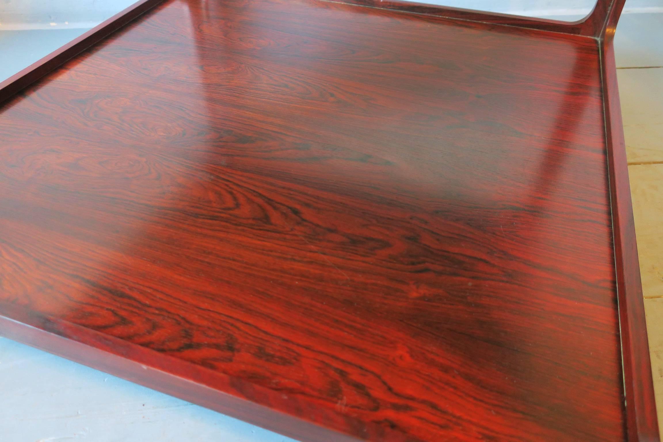 Italian two-tier rosewood coffee table on wheels, 1960s.