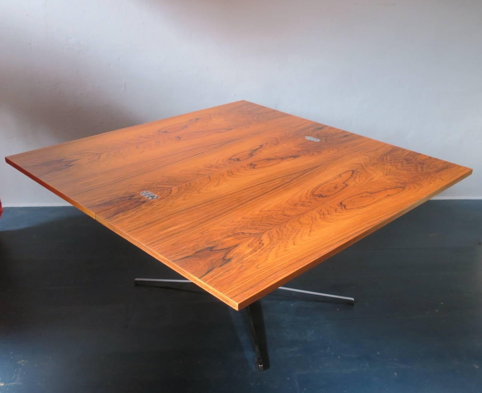 Multi-purpose rosewood table by Wilhelm Renz, 1960s.
Beautiful grain.
The table can be raised or lowered from dining table height down to coffee table (29 inch / 21 inch height). Can be set by means of a handle underneath at any height in that