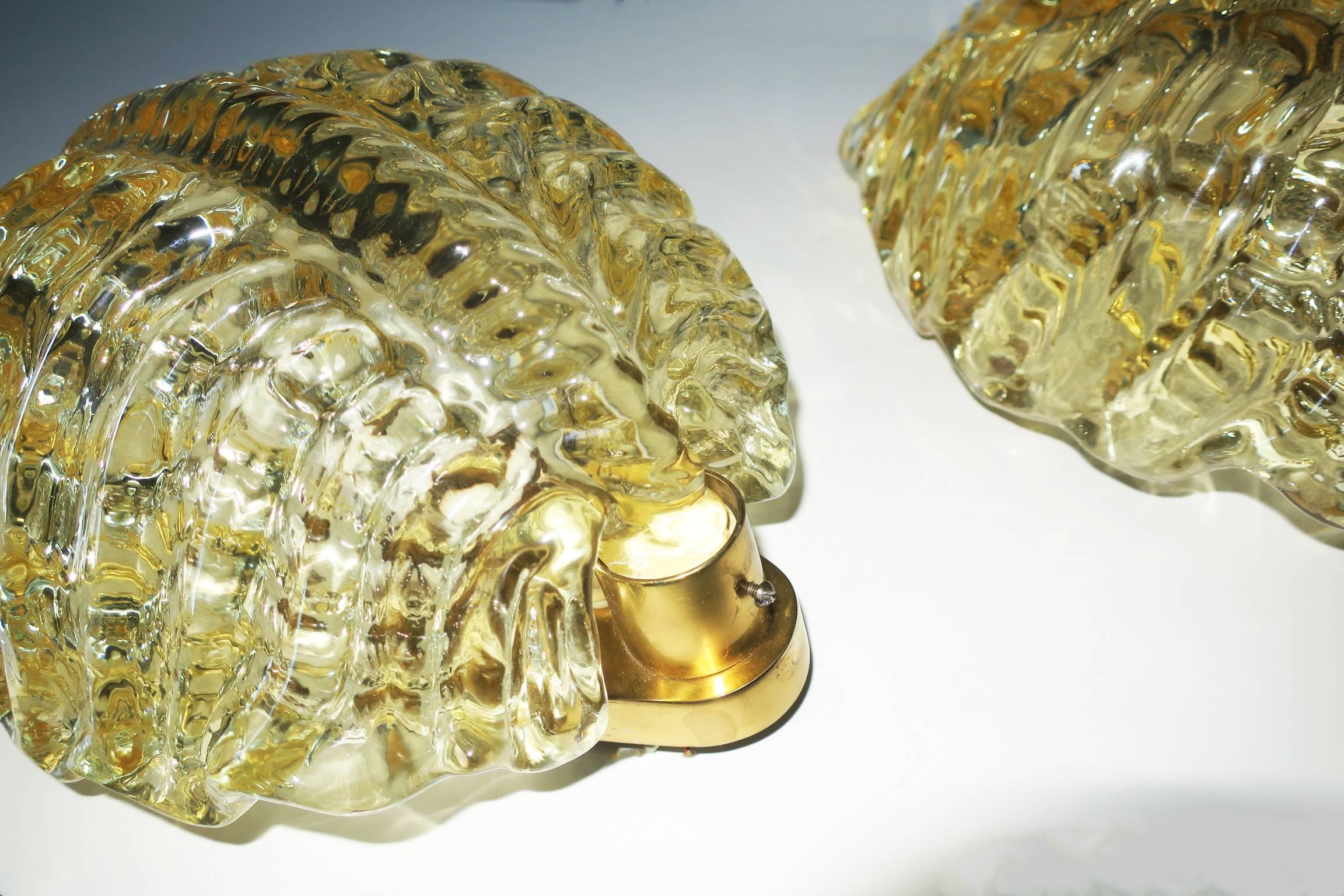 Striking pair of Orrefors amber brass and glass sconces in the shape of turtles with shaped scaled backs, from circa 1960.
The sconces take standard US or European bulbs.
The price is for both sconces.