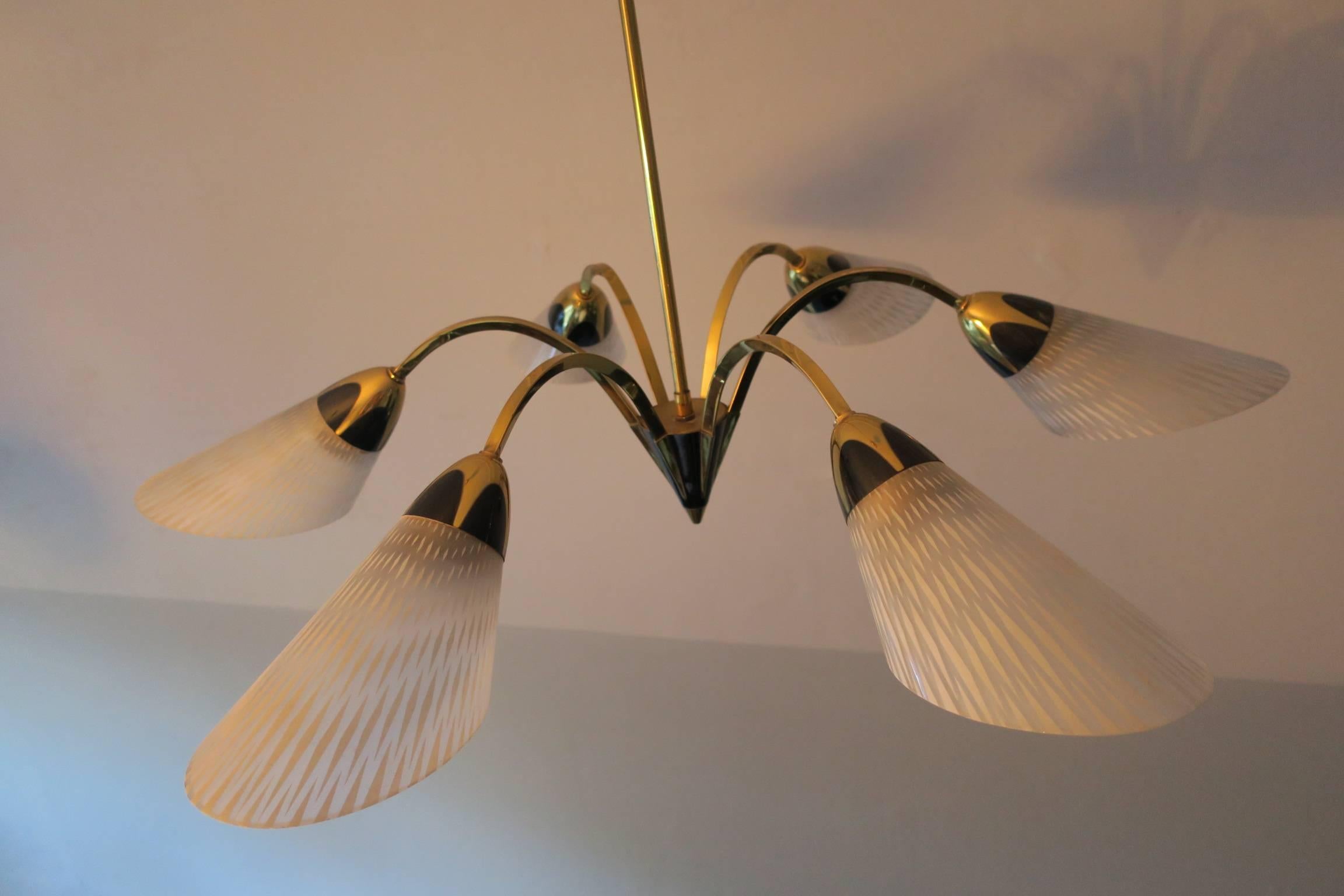 Italian brass and glass chandelier in Stilnovo style with finely designed contrast between black and brass on the six lights, 1950s-1960s.
