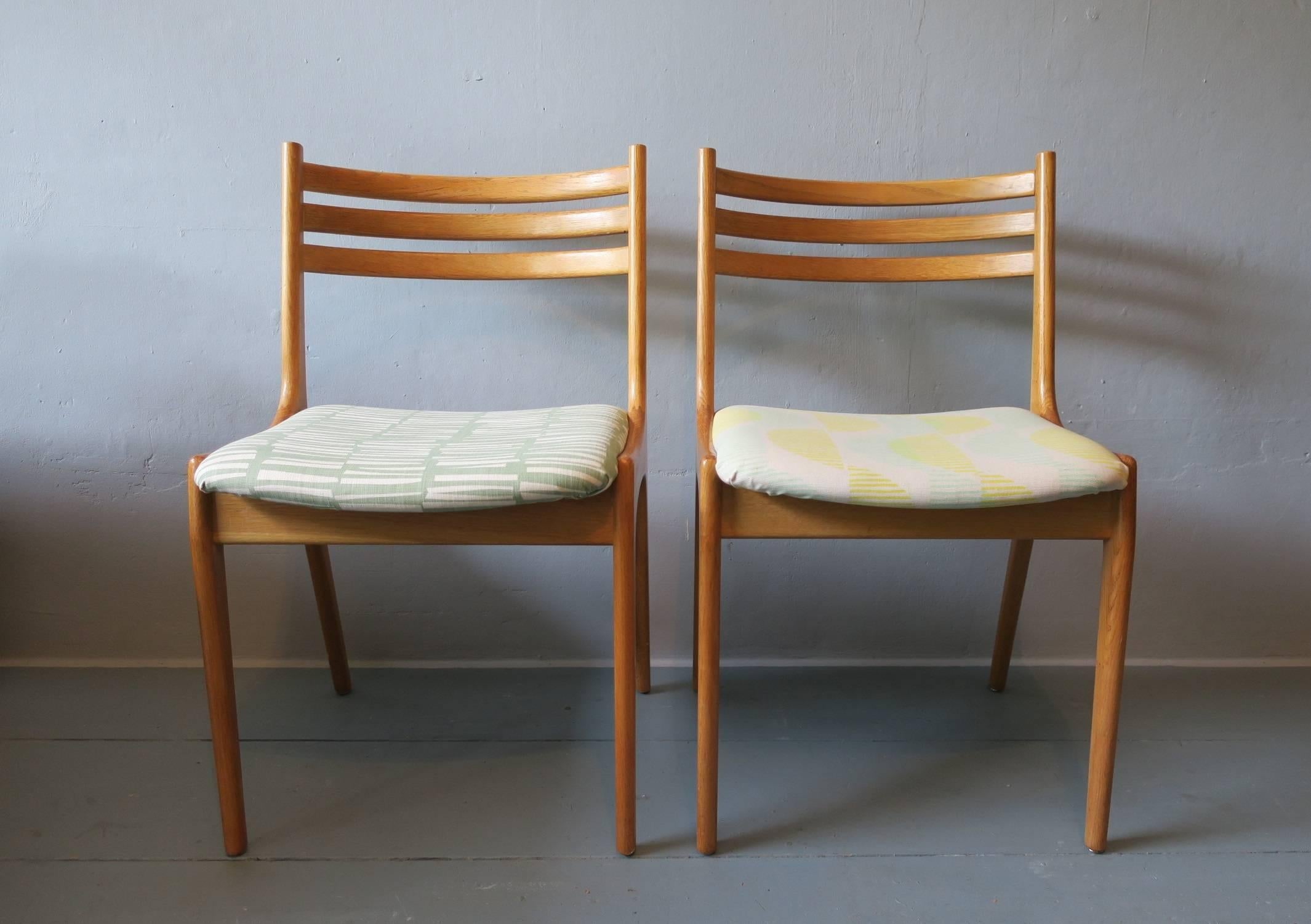 Rare pair of finely shaped Danish elm side chairs.
The chairs are in very good vintage condition and have been newly re-upholstered with fine modern fabric.

 