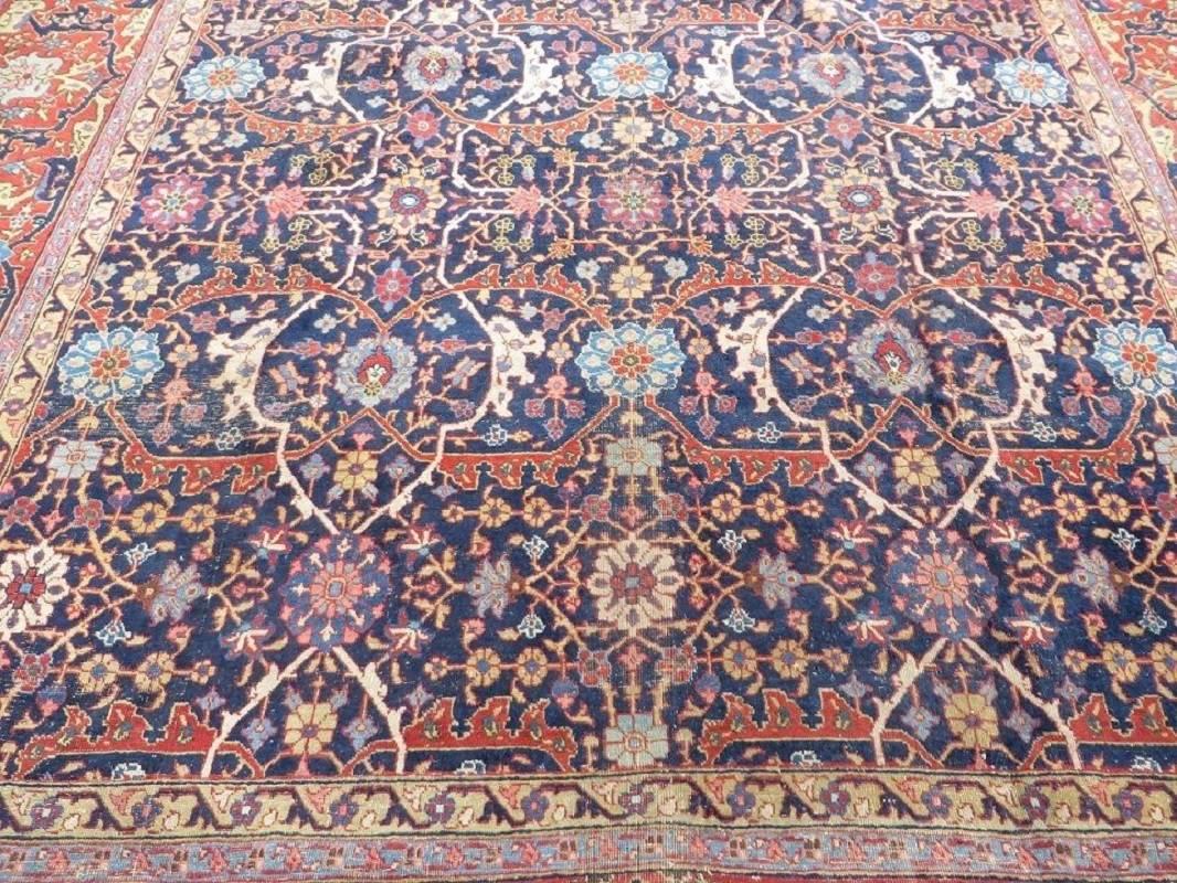 Antique Tabriz carpet with a wide border, big overall design and beautiful natural colors on an indigo background.

Measures: 12 ft 6 ins x 10 ft 11 ins.
380 cm x 300 cm.

Some areas of low pile with some foundation showing
Please see pics.