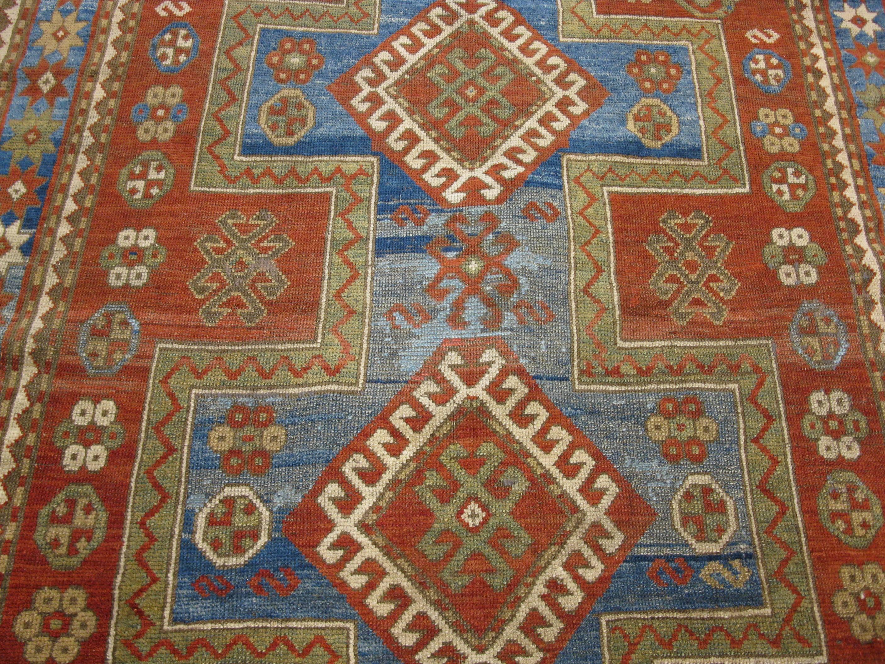 Hand-Knotted Antique Hand Knotted Wool Caucasian Kazak Area Rug For Sale