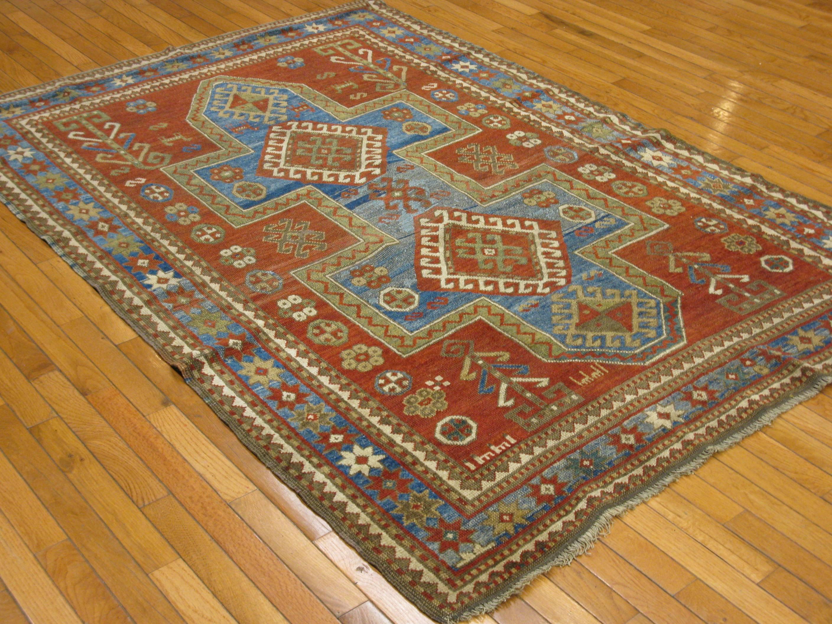 Early 20th Century Antique Hand Knotted Wool Caucasian Kazak Area Rug For Sale