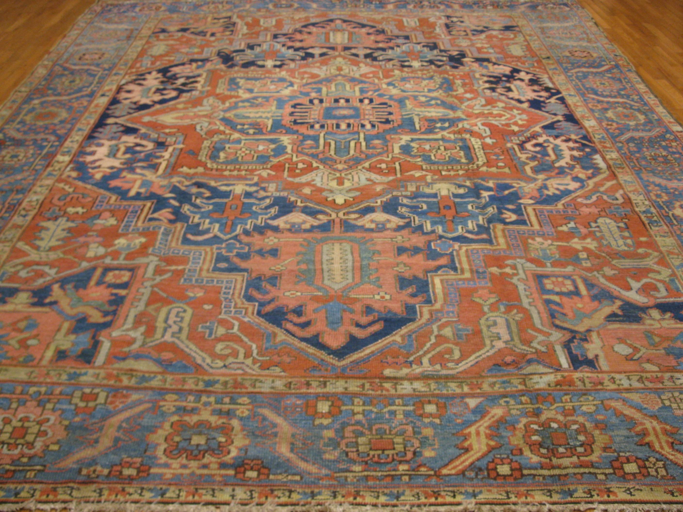 This is a beautiful hand-knotted antique Persian rug from the infamous village of Heriz one of the most sought after type of rugs made. It has a beautiful balance of red and blue colors. It measure 10.5'' x 12.10''.