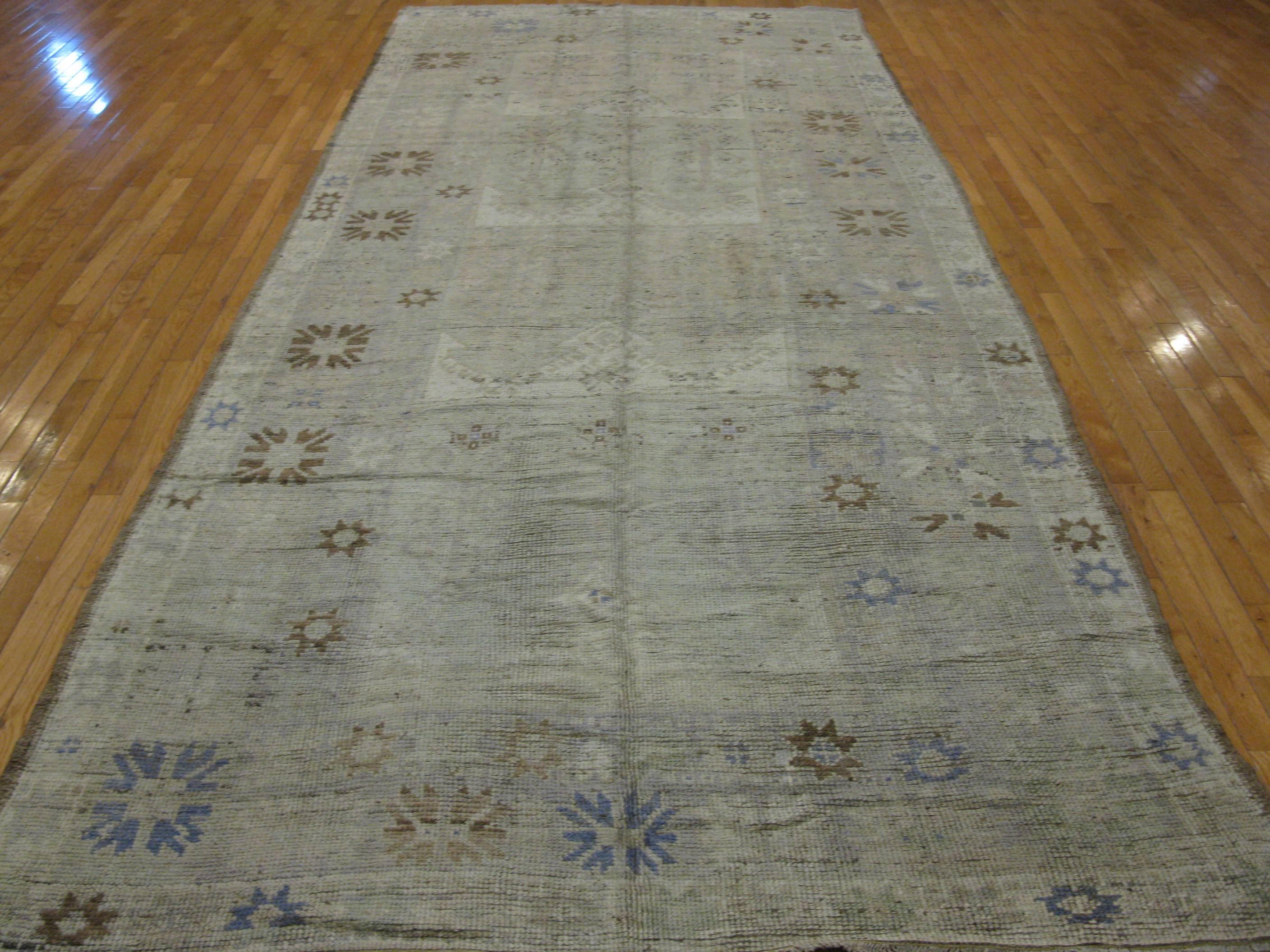 This is a beautiful antique washed hand-knotted genuine vintage Anatolian Oushak style Turkish rug in a wide and long gallery size. The rug measures 5' 9'' x 13' 10'' made of 100% wool in soft neutral tones.