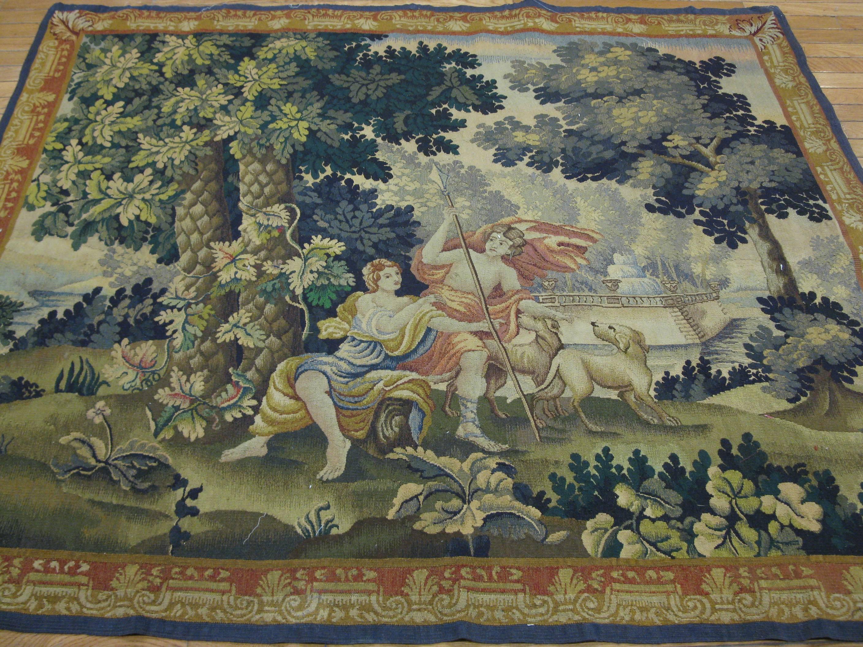 This is an fine genuine antique French Aubusson wall hanging tapestry. It measures 5' x 6' made with a combination of wool and silk. It is in great condition.
