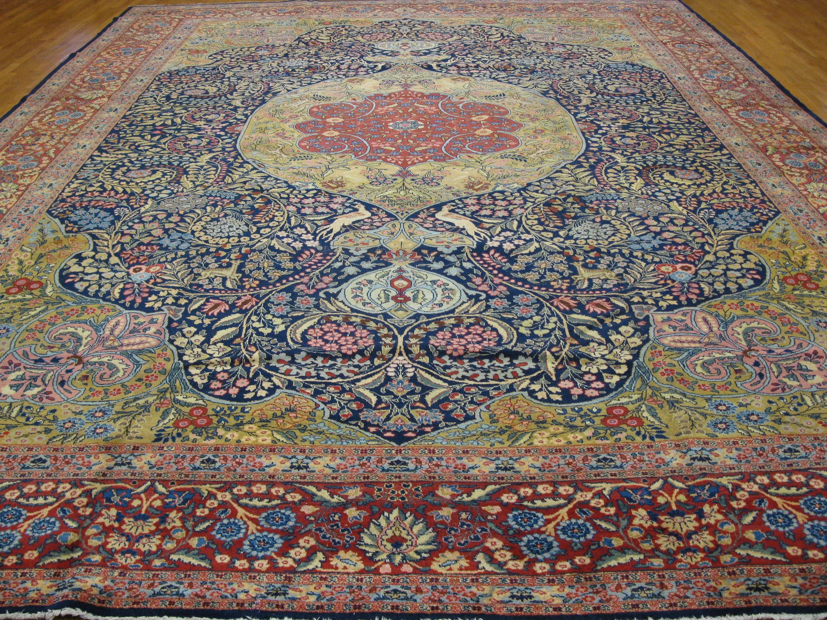 This is a fantastic large antique Persian Tabriz rug in a detailed traditional floral design. It measures 13' 2'' x 17' 9'' made with fine wool from northwest Iran on a cotton foundation. The rug is in great condition.