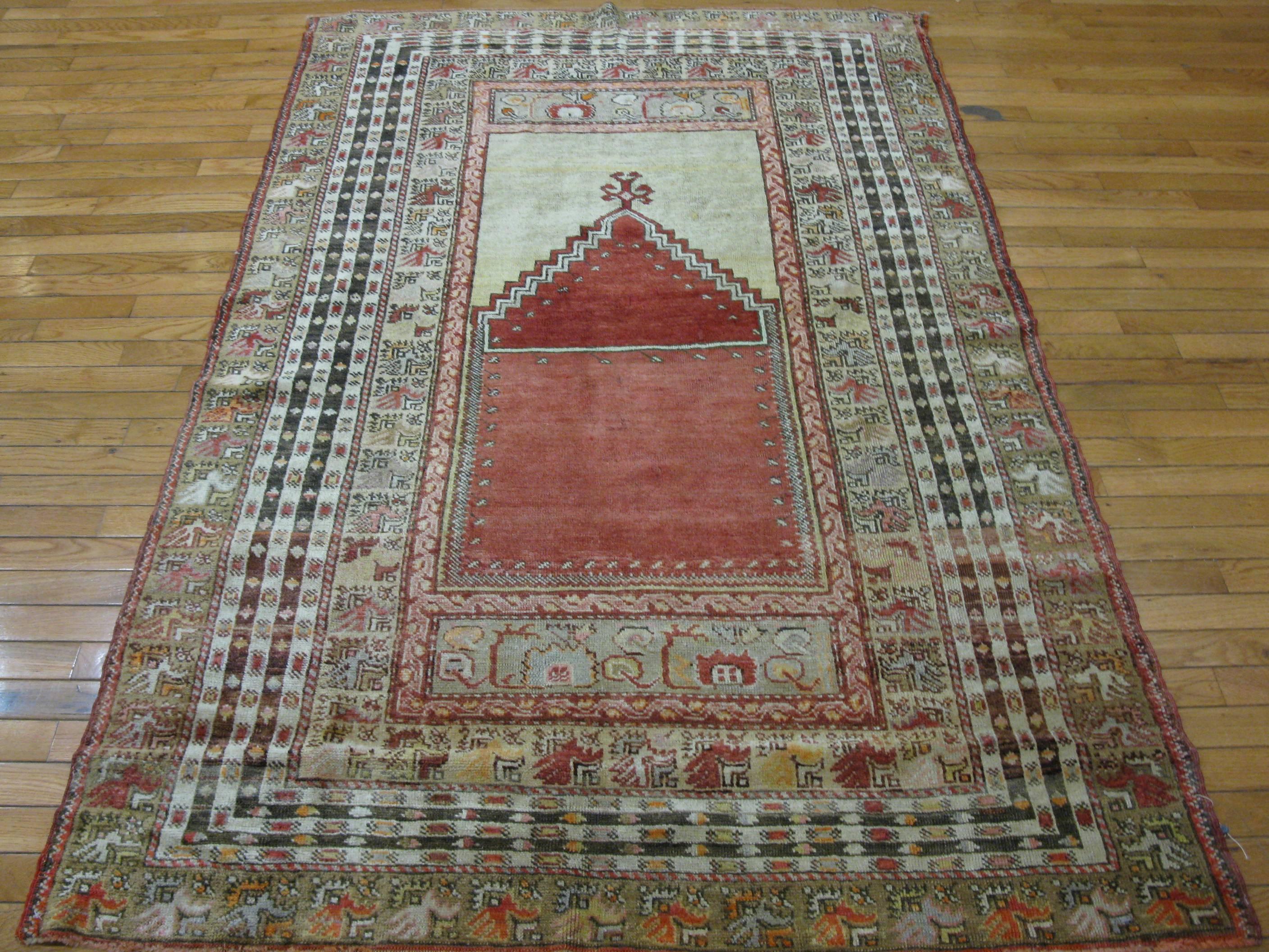 This is a finely hand-knotted traditional Turkish rug with a Mehrab design pattern. It is made with 100% Fine quality wool pile on wool foundation. It is in great condition. The rug measures 4. 3'' x 6.8'' made first quarter of the 20th century.