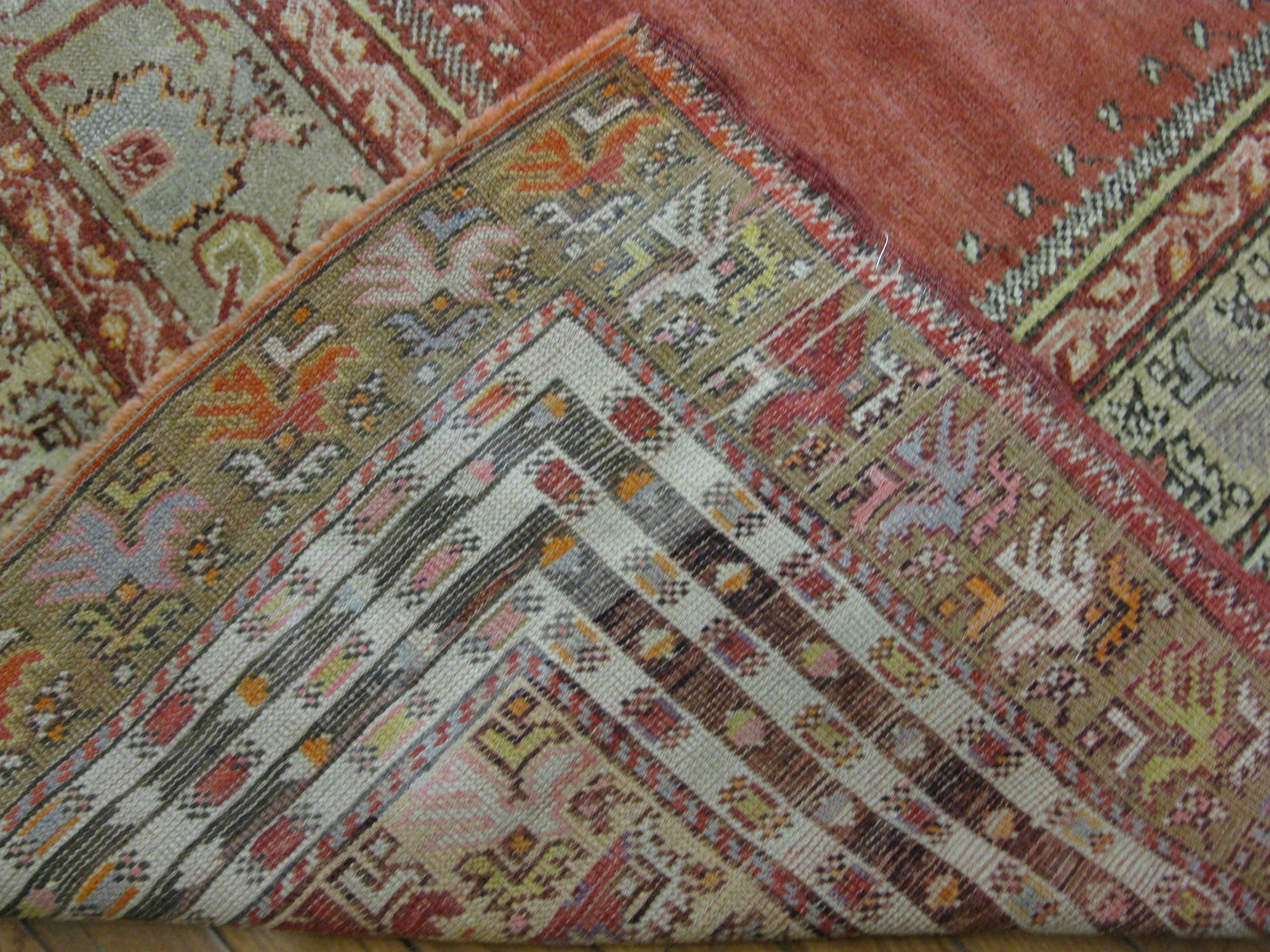 Small Hand Knotted Wool Turkish Rug In Red Color Field In Excellent Condition For Sale In Atlanta, GA