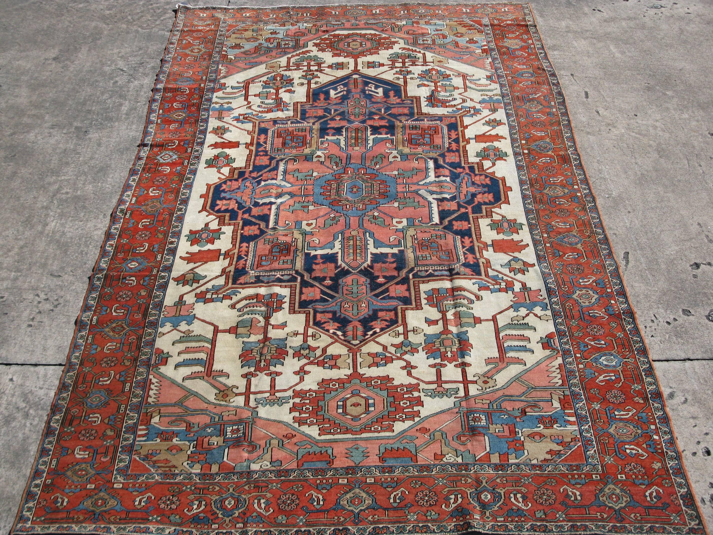 This is a fantastic hand-knotted antique Persian Serapi rug. It has a hard to find size with a very fine weave. It measures 8' 4'' x 13' 6'' and is in excellent condition.