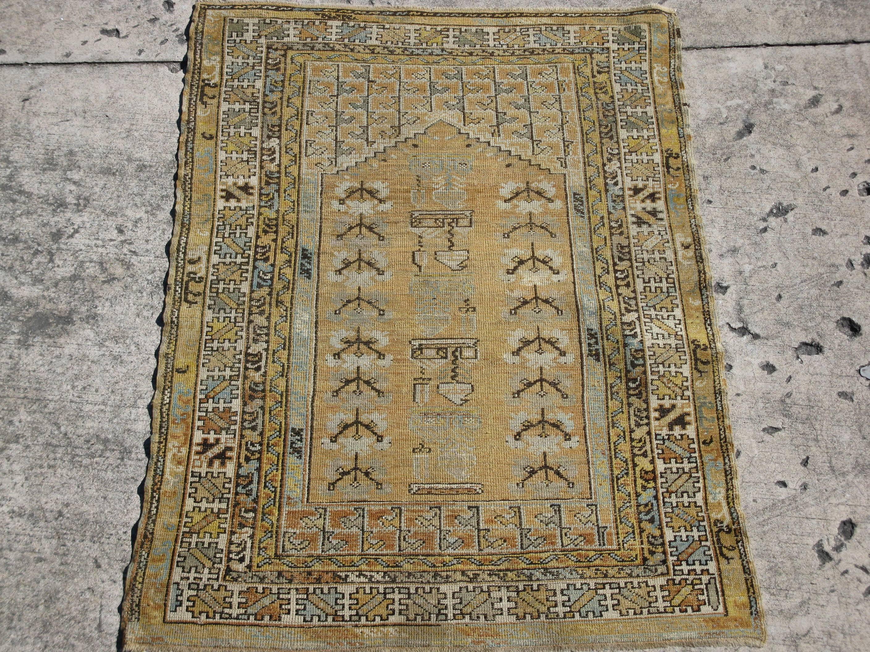 This is a unique and beautiful small hand-knotted rug from the Anatolian region of Turkey. The rug has beautiful soft color combination with all natural earth tone colors. It is in great condition and measures 3' 10'' x 5' 6''.
