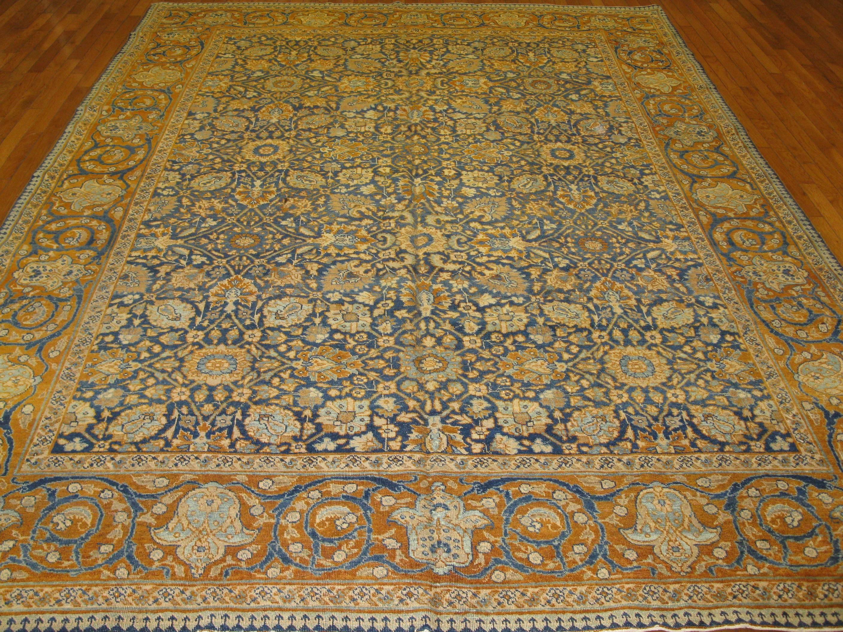This is a fantastic example of the turn of the century Persian Tabriz rugs. It has a rich and elegant look. The rug is made of wool and cotton with natural dyes. It measures 7'8'' x 10' and in excellent condition.