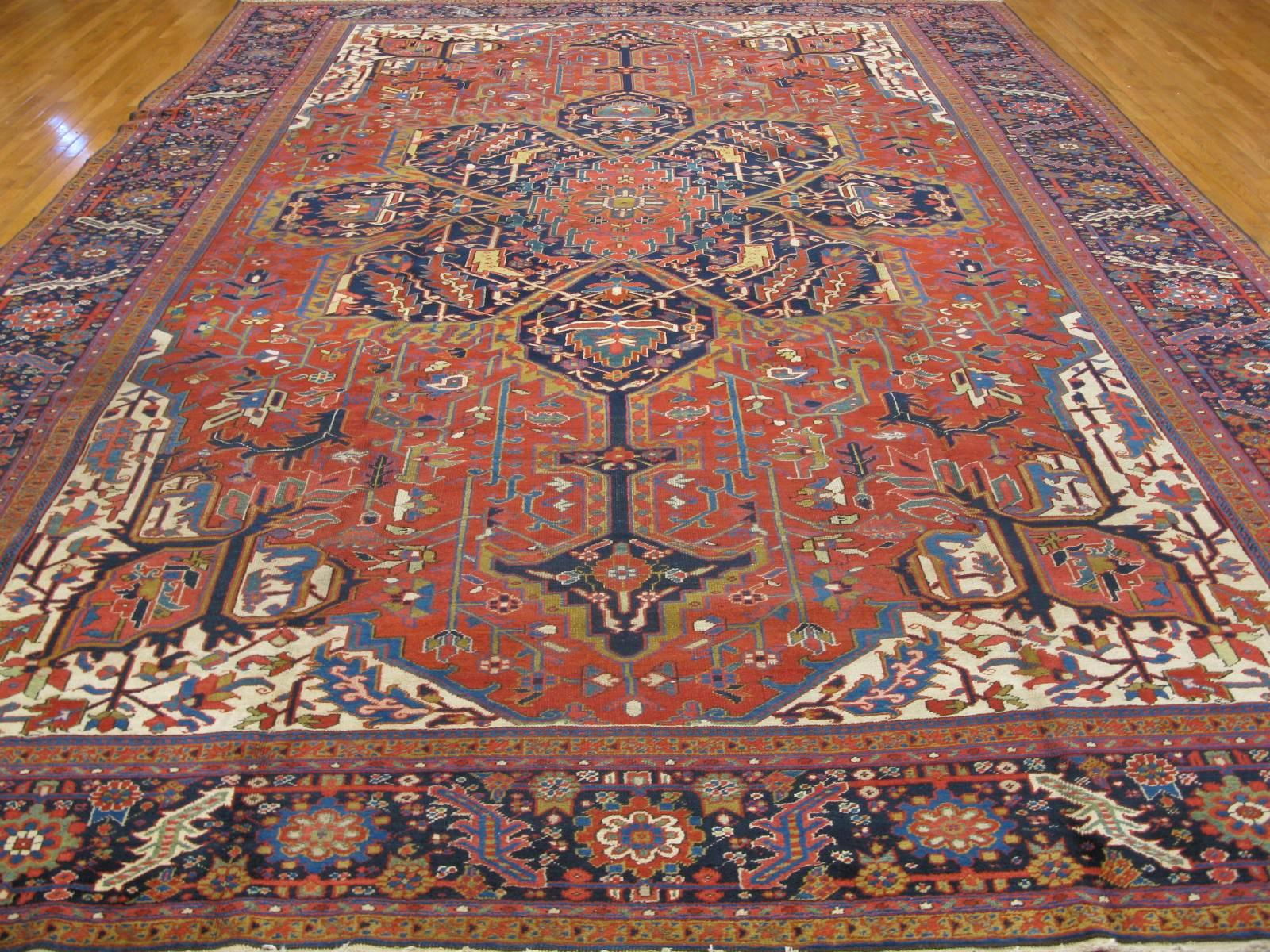 This is a beautiful large antique hand-knotted Classic Persian Heriz rug. Its rich color and distinct design would make a beautiful statement in any room. The rug measures 11' x 16' and in great condition.
     