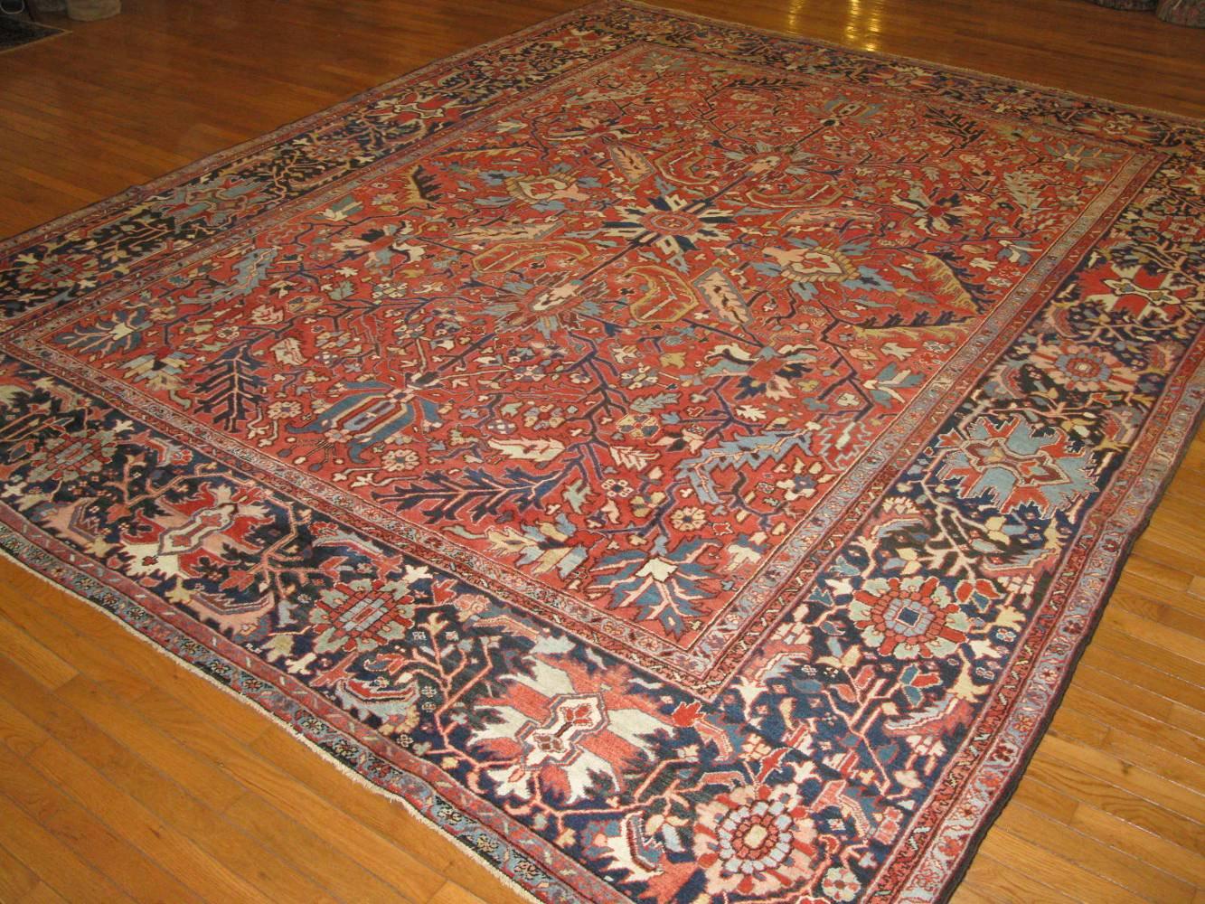 This is a beautiful antique hand-knotted Persian Heriz/Serapi rug. It has an easy all-over pattern design to work with. It has a Fine and uniform weave. The rug is in excellent condition and measures: 10' x 12' 4''.