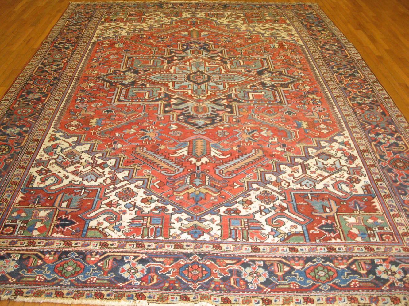 This is a beautiful antique hand-knotted rug from the infamous village of Heriz in northwest Iran. The rug has the traditional geometric design. It is a very easy and sought after rug to work with. It measures 8.5” x 11.5” and in great condition.