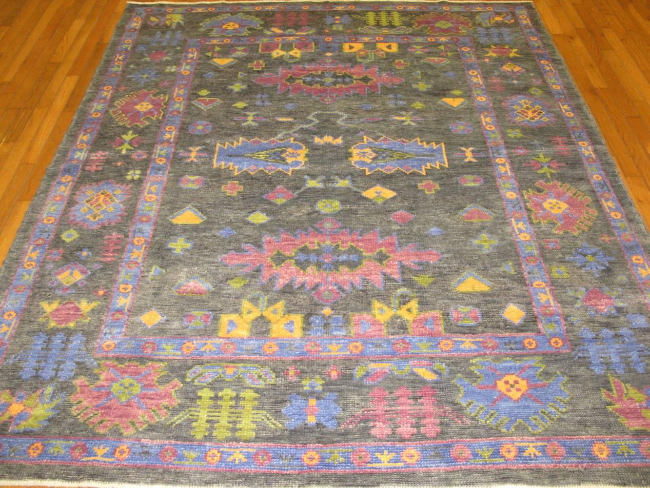 This is a beautiful new handmade Turkish Oushak rug with fresh and bright colors recapturing the look of the antique Oushaks of the early 20th century.
It is made with all wool and natural dyes. It measures 6' 3” x 7' 8”.