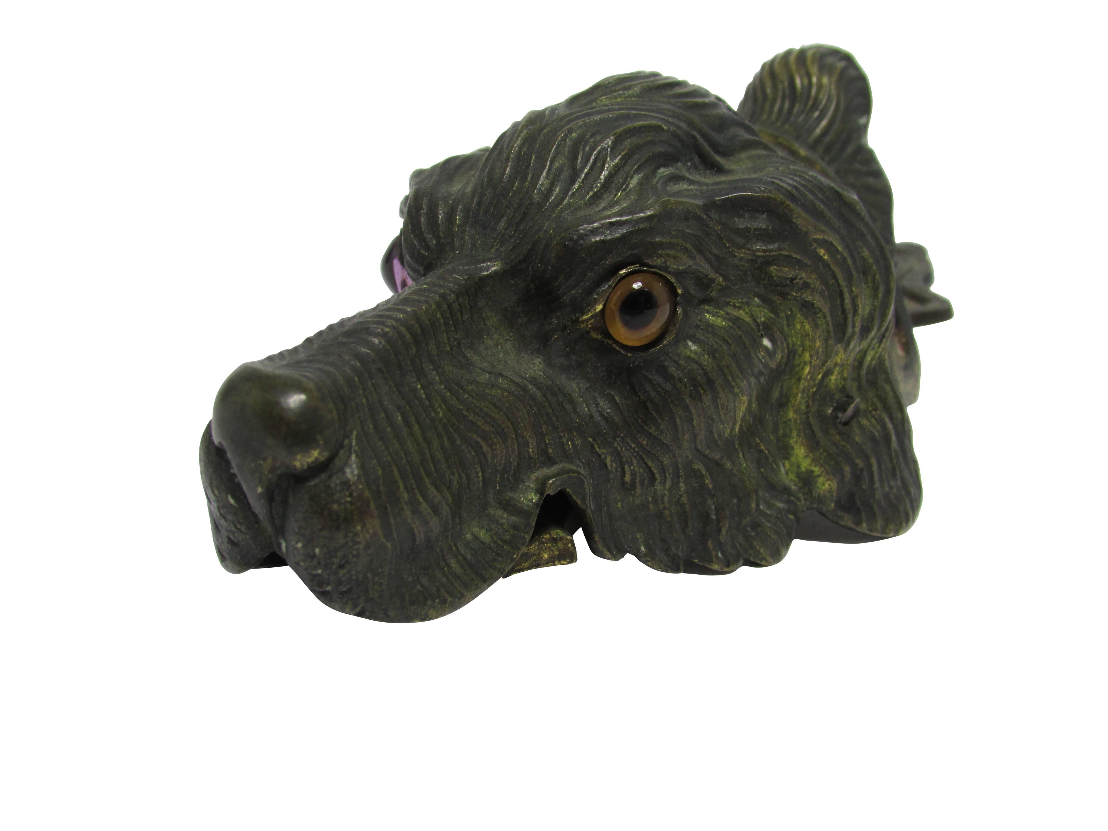 This is a turn of the century Vienna bronze figural dog head letter clip with glass eyes. It can be wall-mounted or sit desk top.
