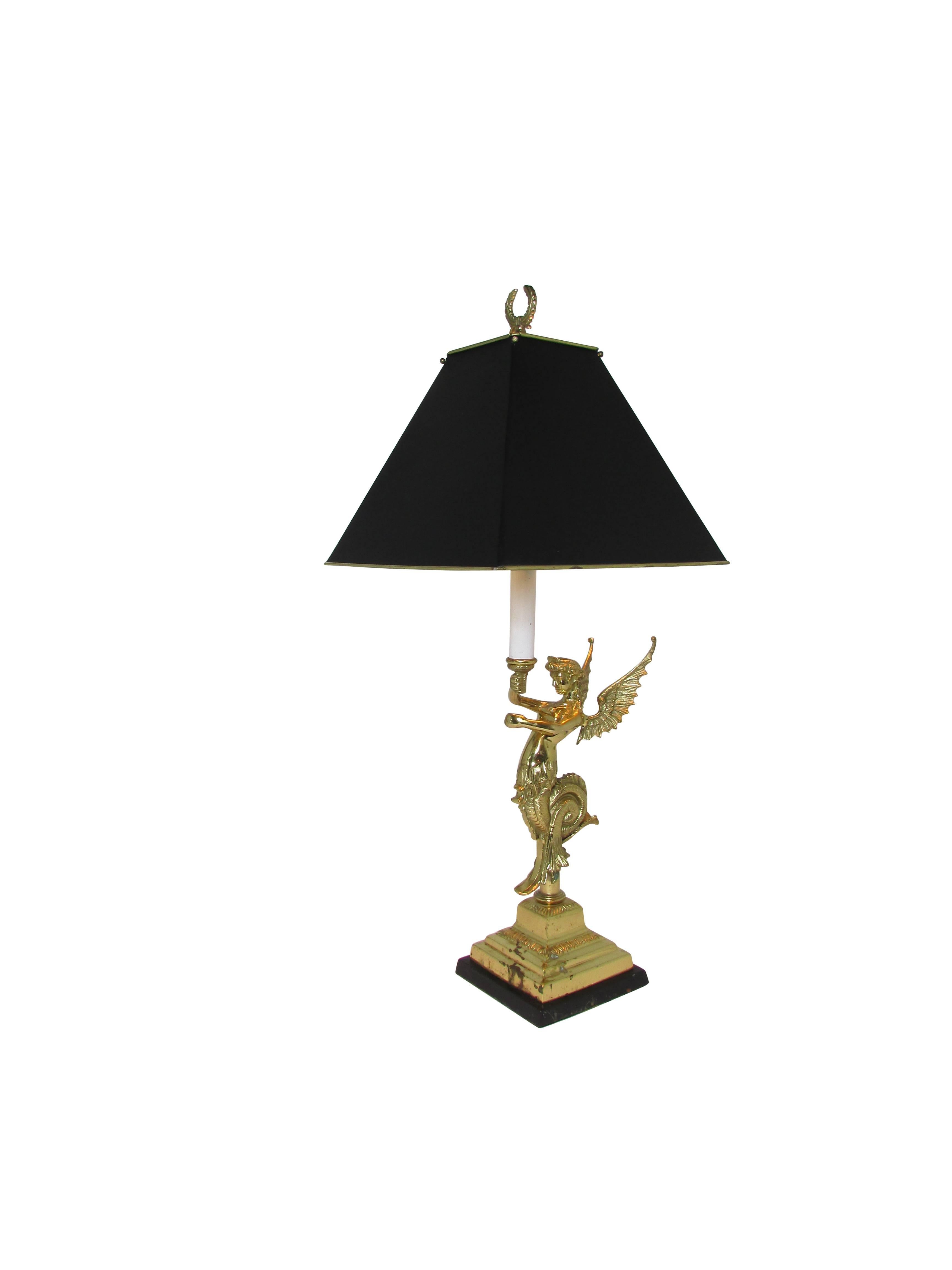 This is a cast brass figural siren table lamp complete with stunning brass shade with a matte black exterior finish and a brass wreath finial.