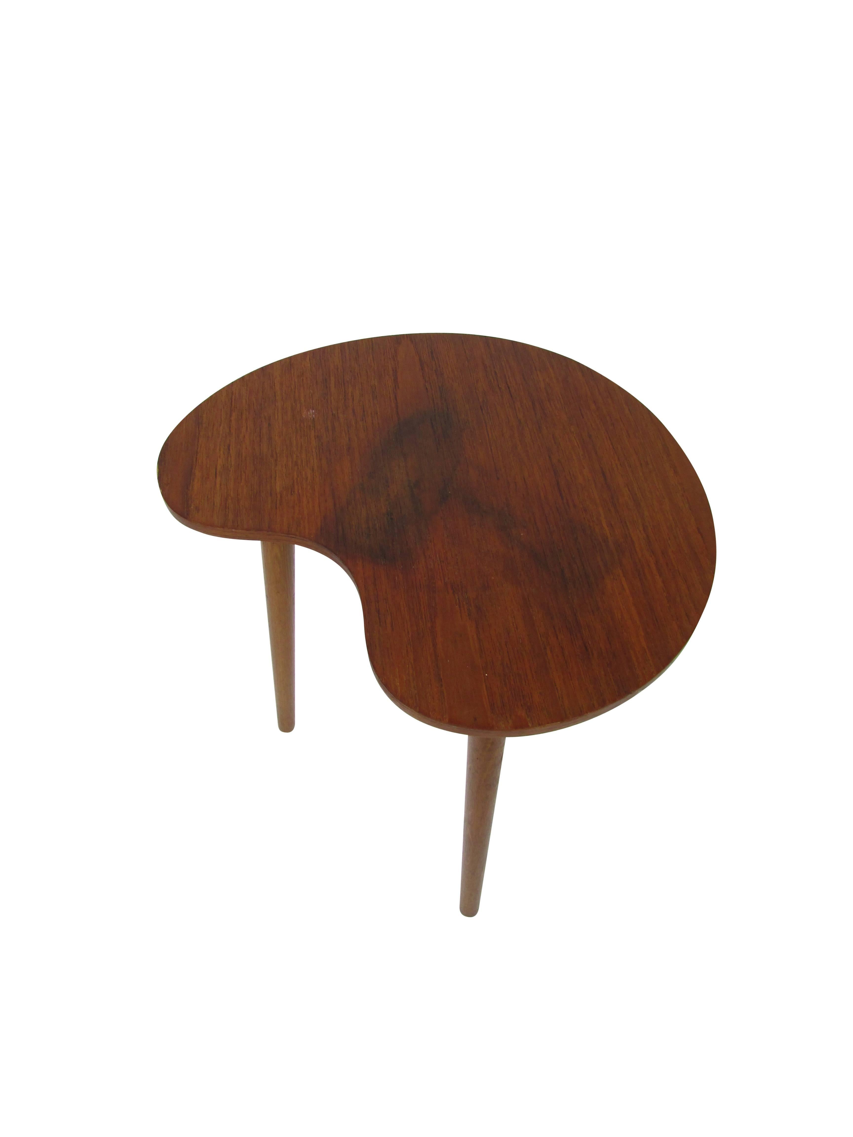 This is a vintage Danish palette shaped side table with hidden ashtray by L. Chr. Larsen & Son, circa 1950.
