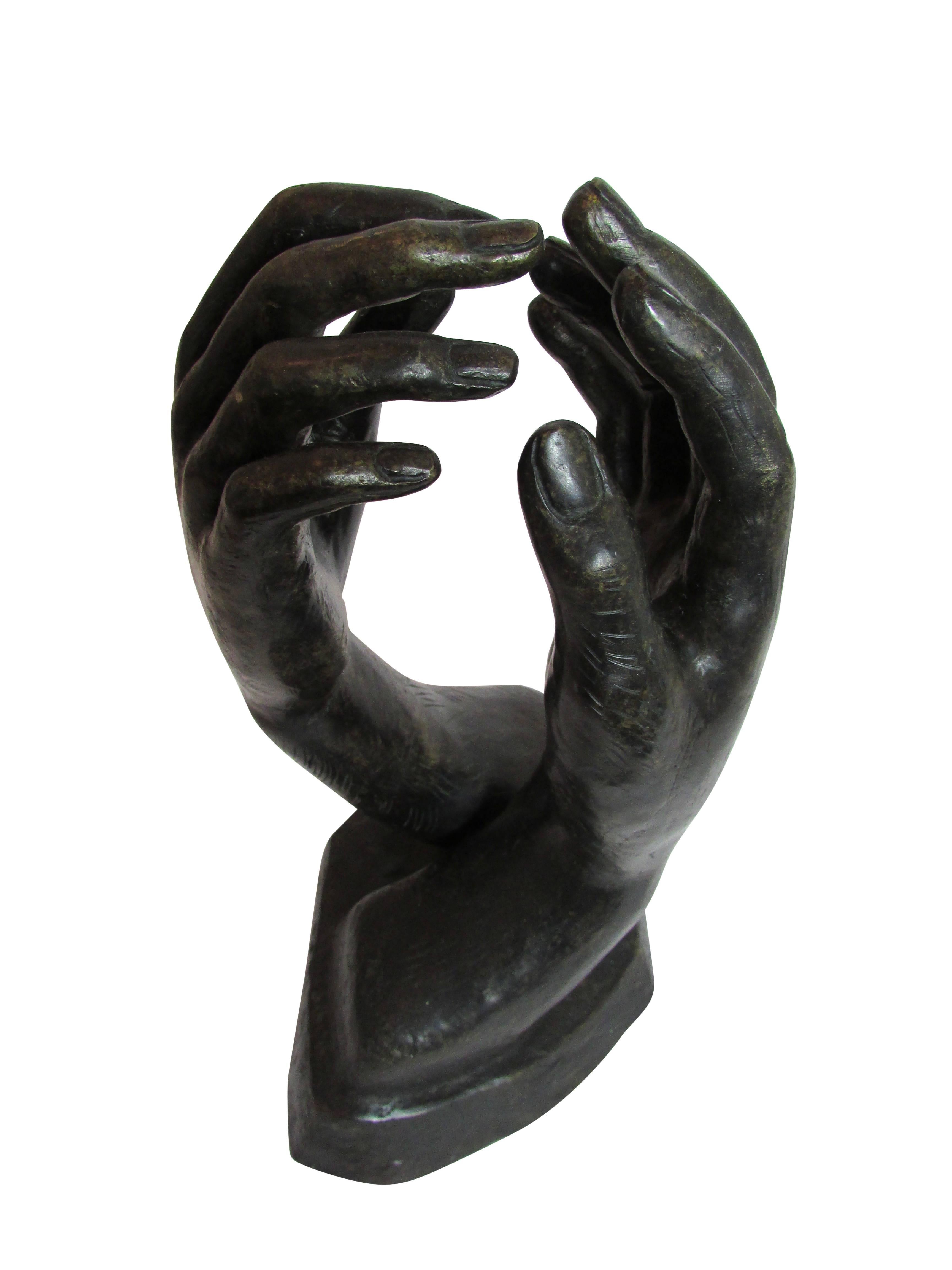 This is a bronze sculpture of two lovers holding hands, circa 1970.