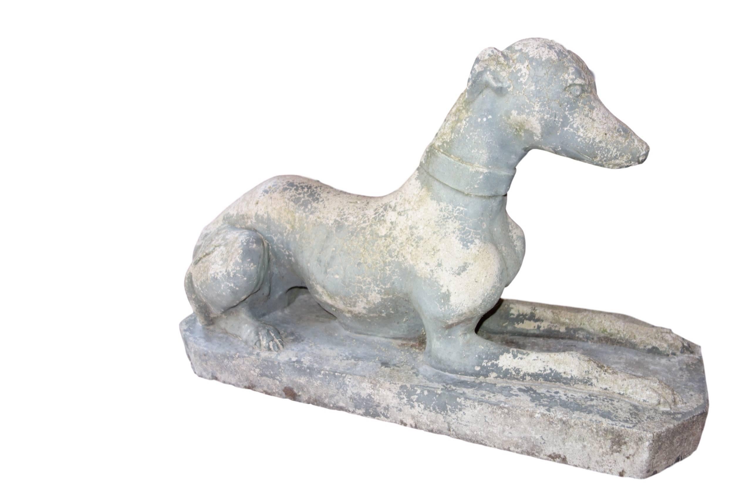 This is a lovely Whippet concrete garden statue from England.