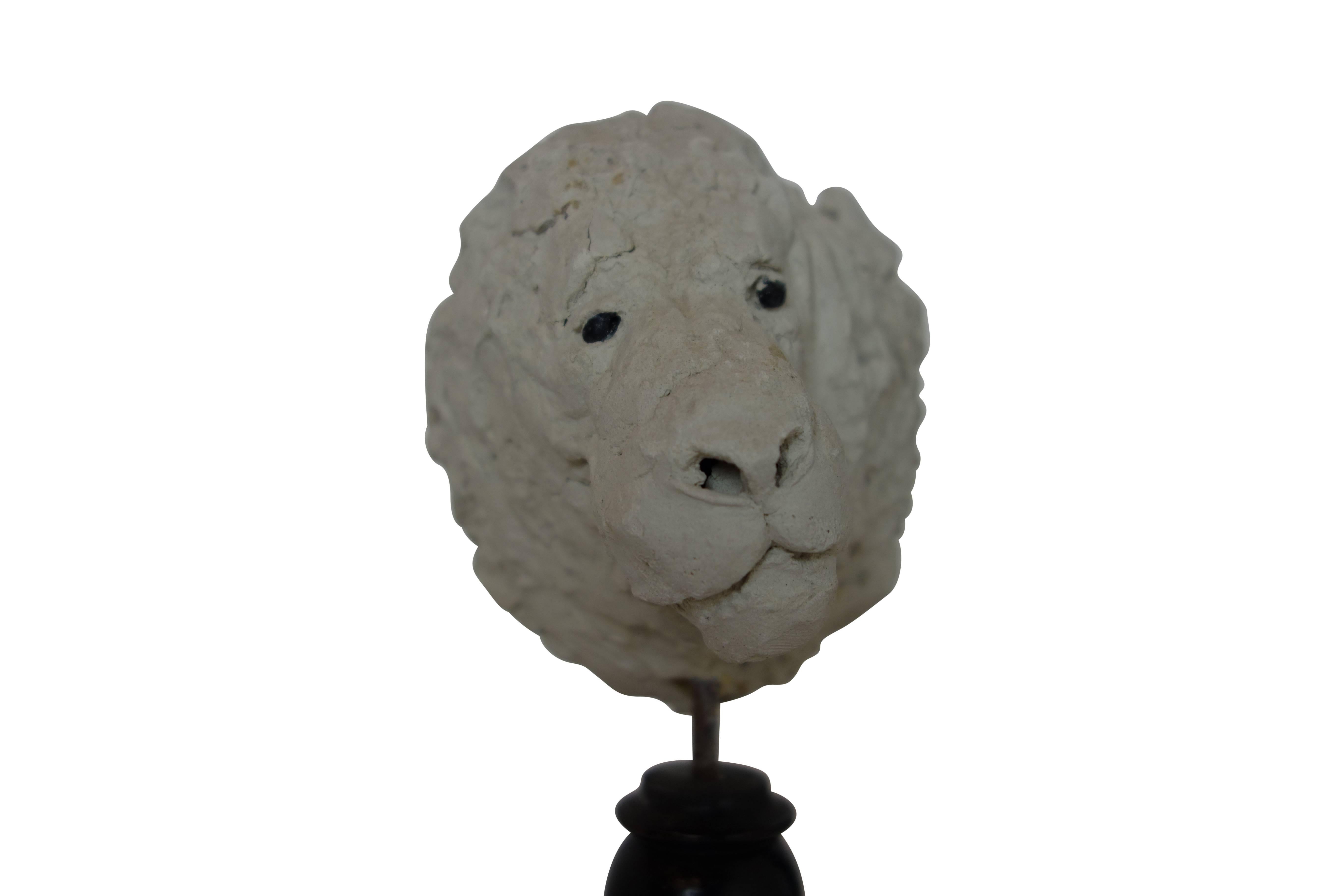 This is an expressive 19th century plaster lion head sculpture mounted on a beautiful turned wood stand.