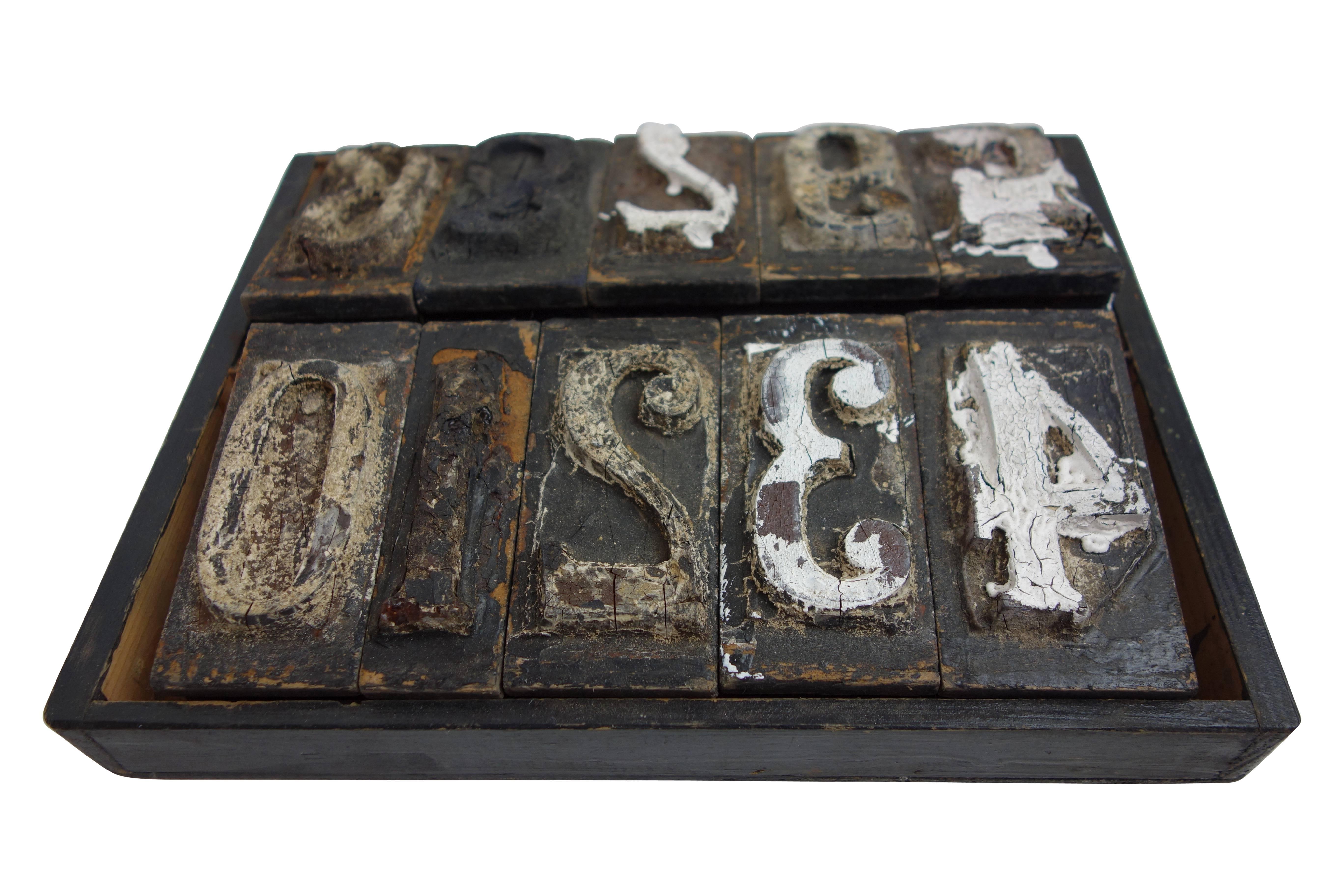 This is a set of early wood carved number print blocks from France.