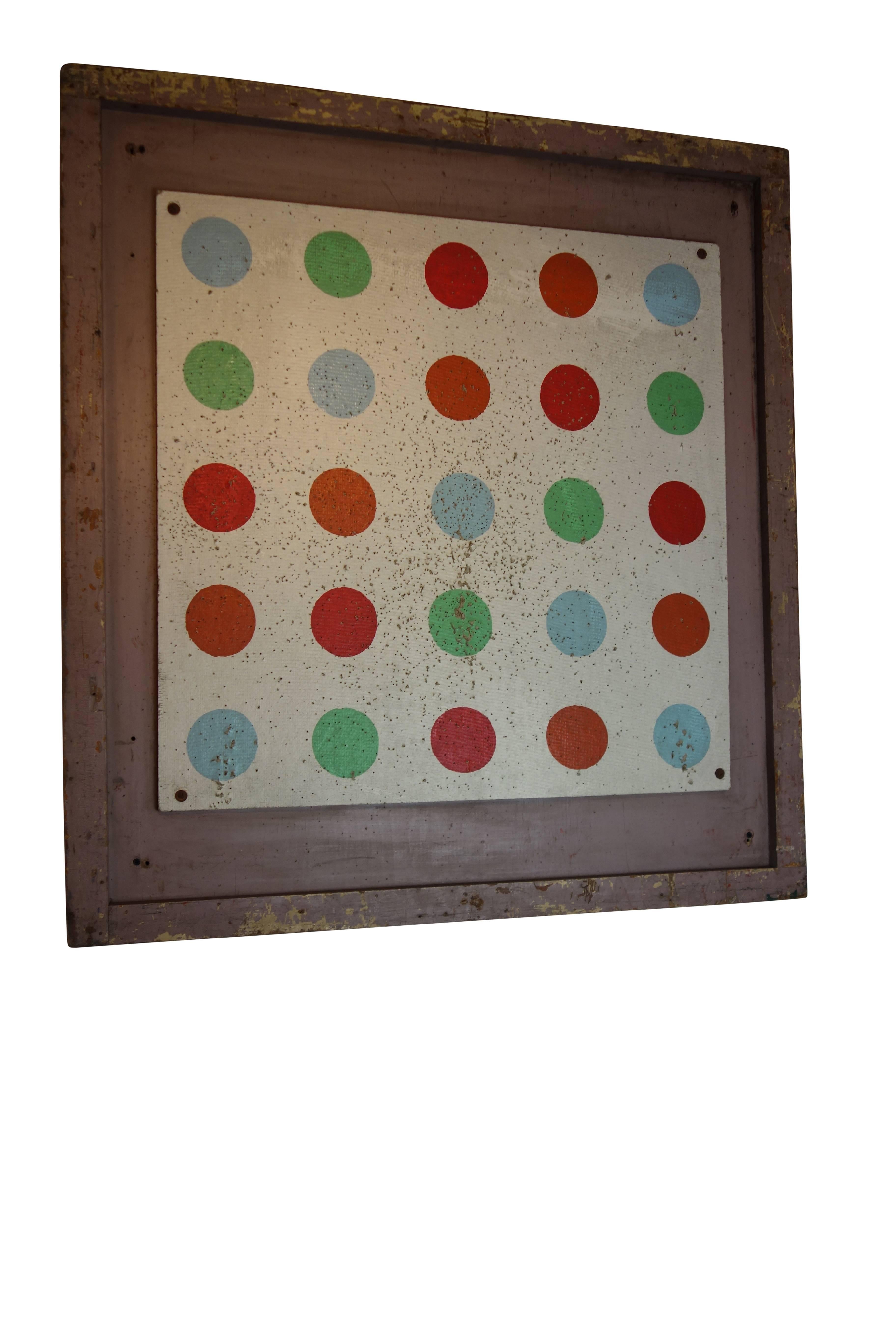 This is a balloon dart board panel on its original painted wood frame from a carnival in Riverside Park, Wisconsin, circa 1920. The brightly colored polka dots give it a modern pop art feel.  There is a slightly larger pair to this panel, see other