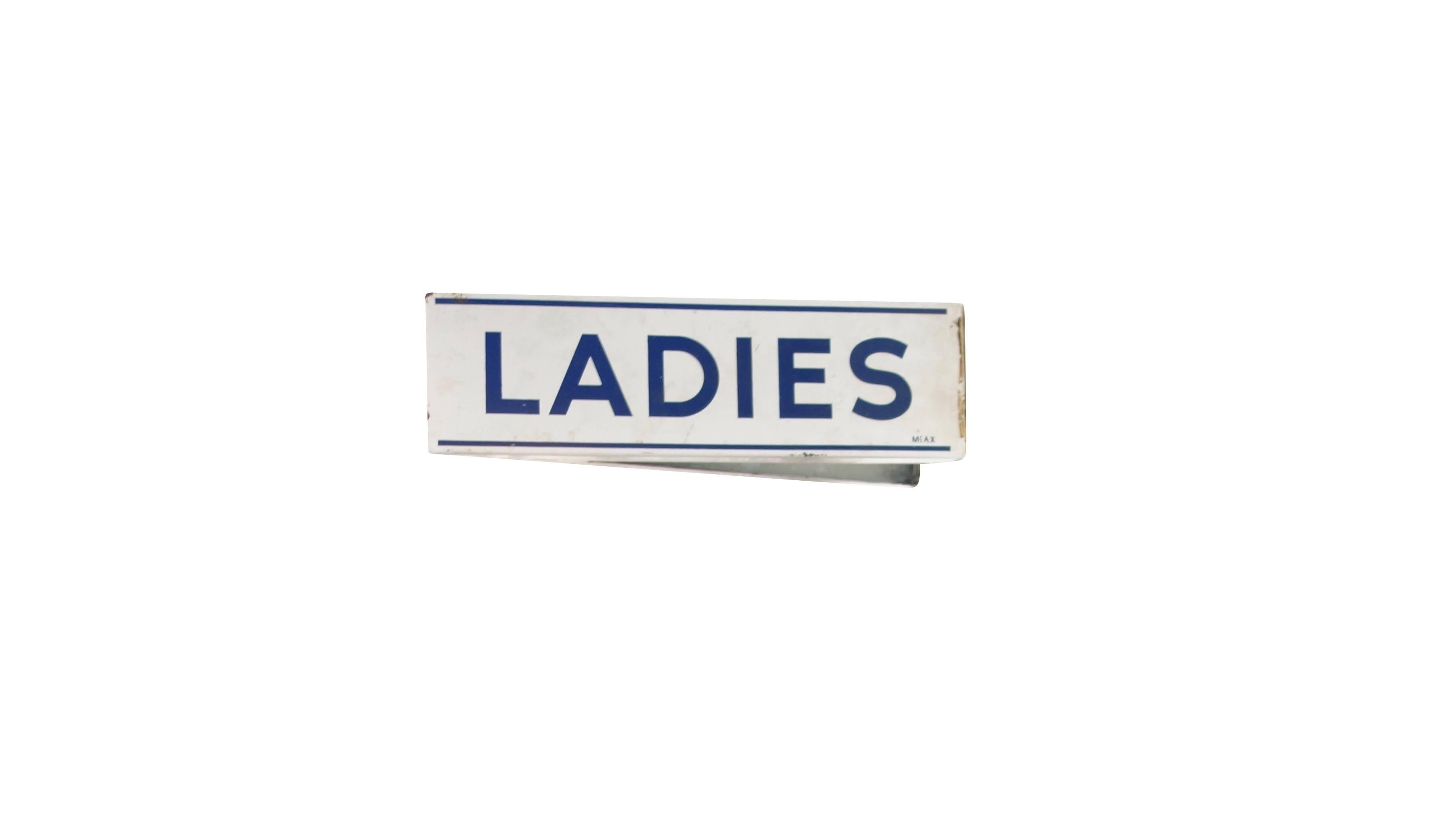 This is a double sided wall mount porcelain enamel ladies restroom sign in excellent condition.