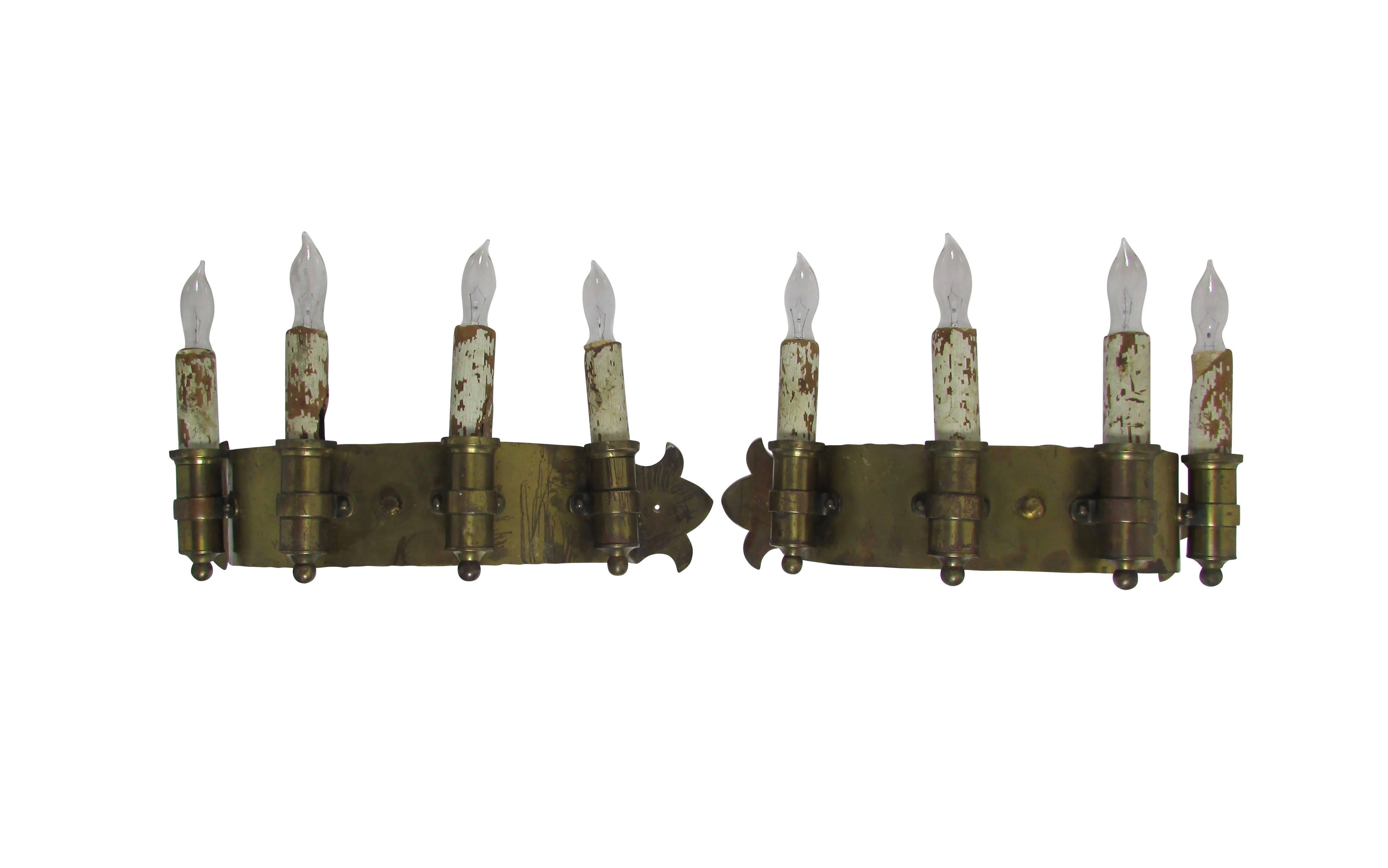This is a pair of early 20th century brass four candle sconces.

 