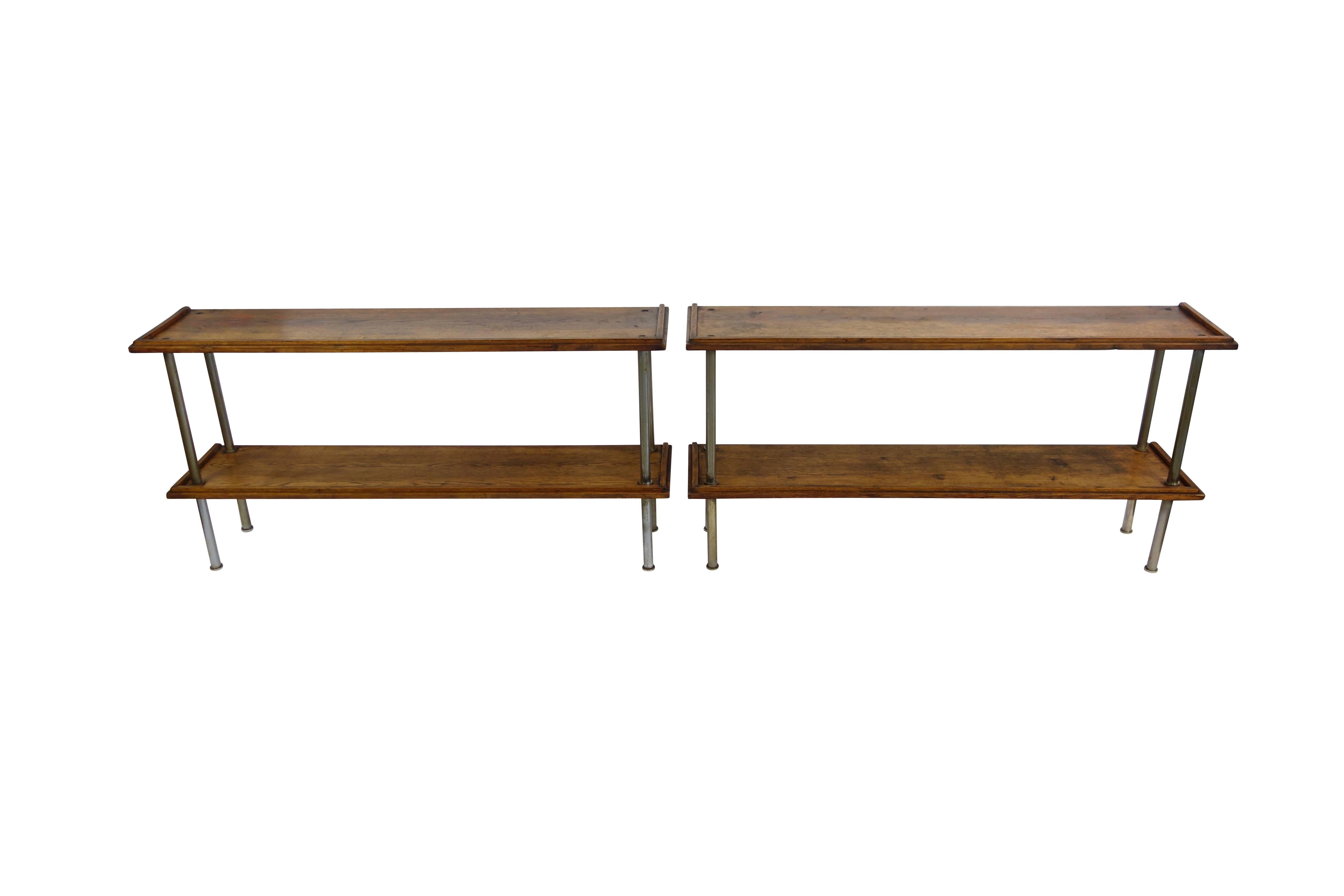 This is a fantastic pair of wood consoles with circular steel legs from France. These are so versatile; they can be stacked one on top of the other, set side by side making one long console, or abutted together back to back making one deeper