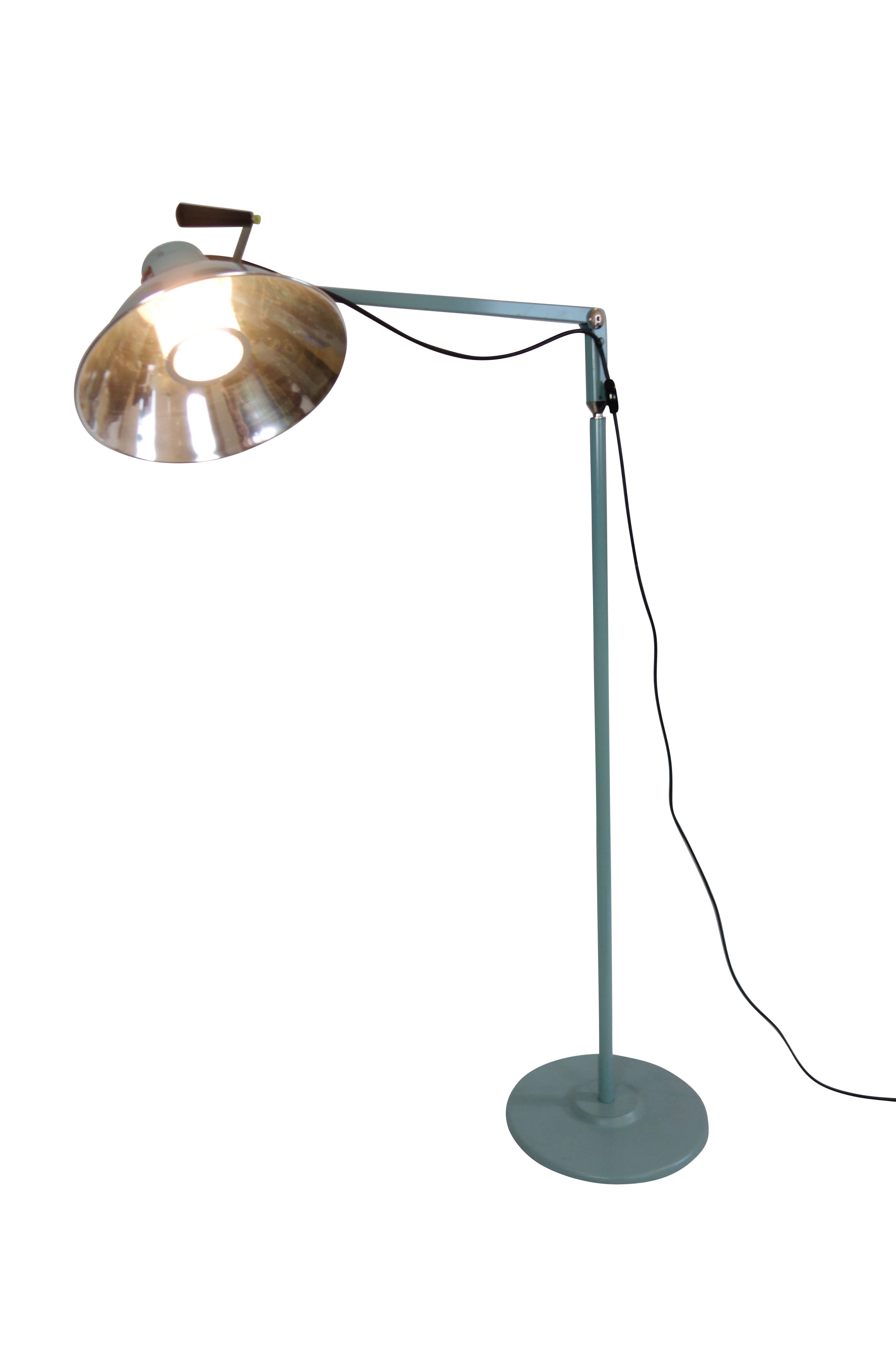 This is a Mid-Century articulating medical operation and examination floor lamp.