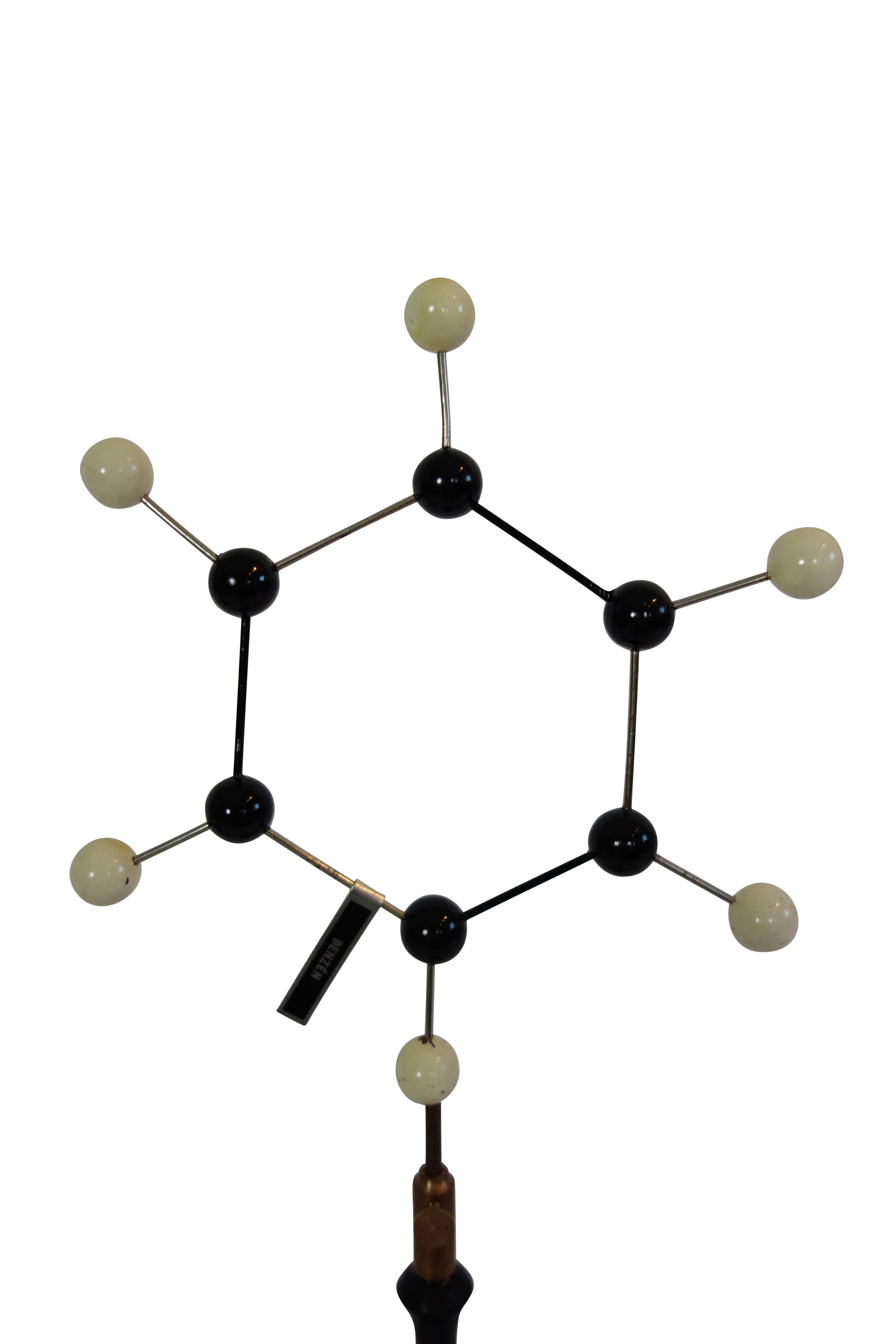 This is a 1950s molecular structure of Benzene from France labeled 'Benzén' and mounted to a wood stand.