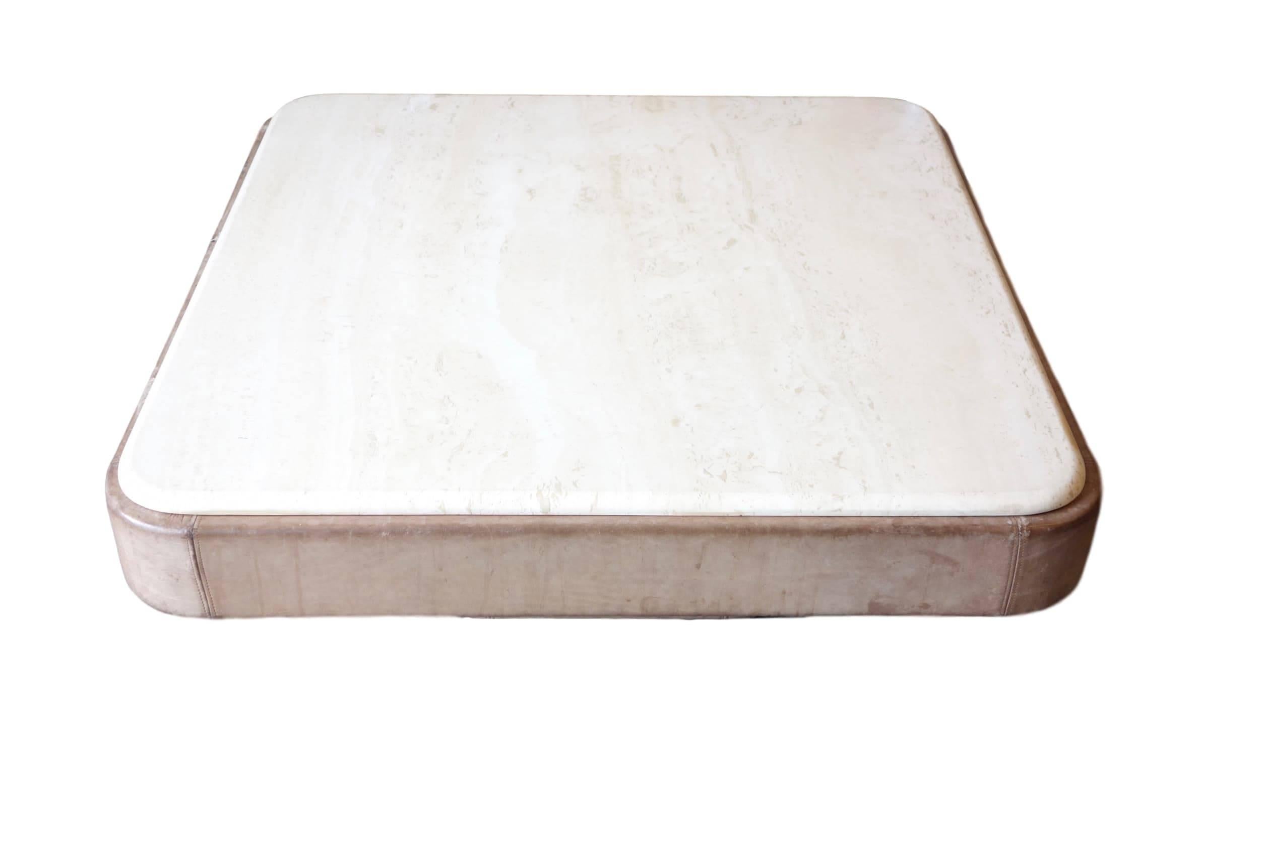 This is a gray leather coffee table with travertine top by De Sede. Made in Switzerland, circa 1970.