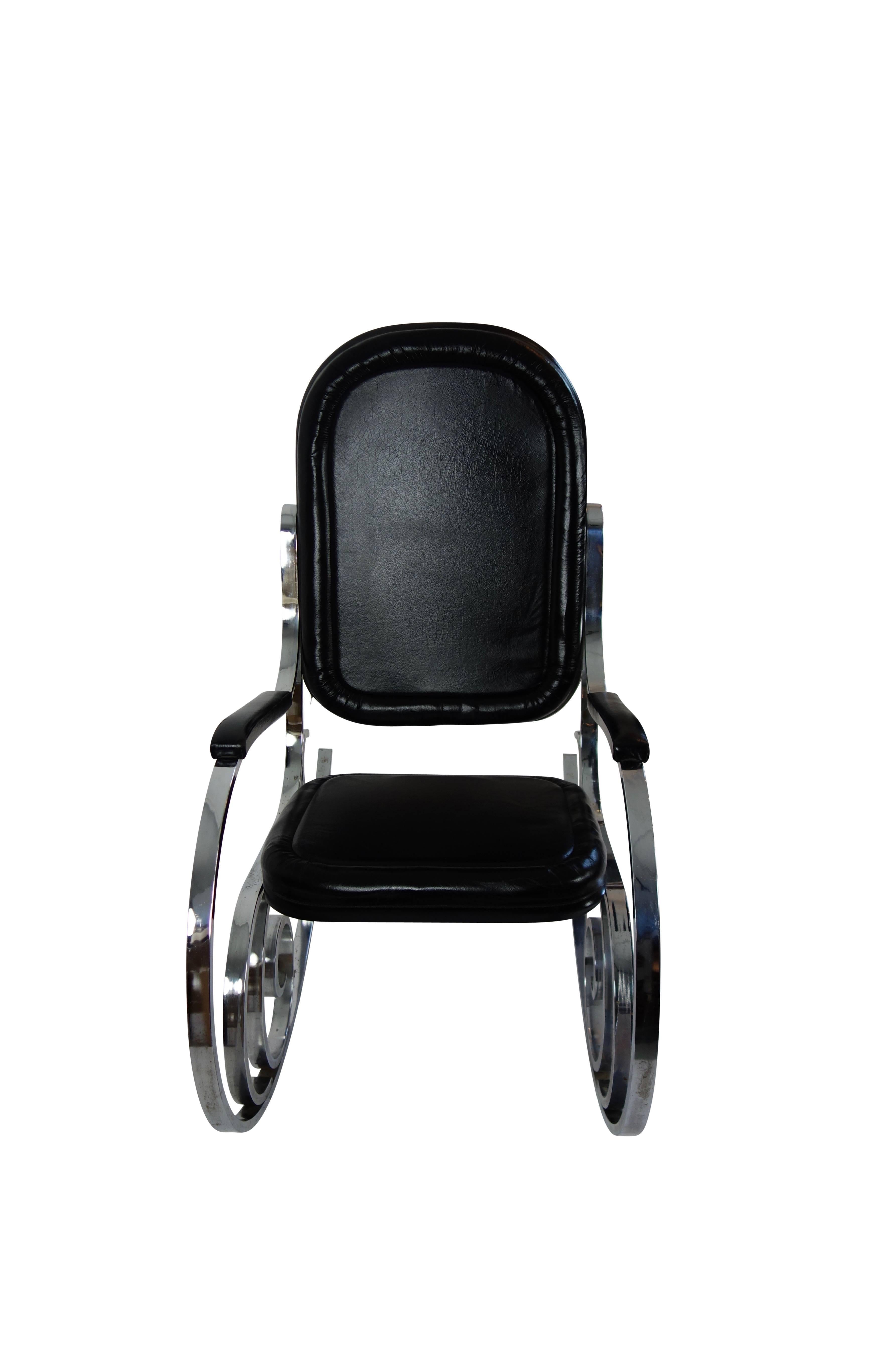 This is a black leather and polished nickel rocking chair by Maison Jansen from France, circa 1970.