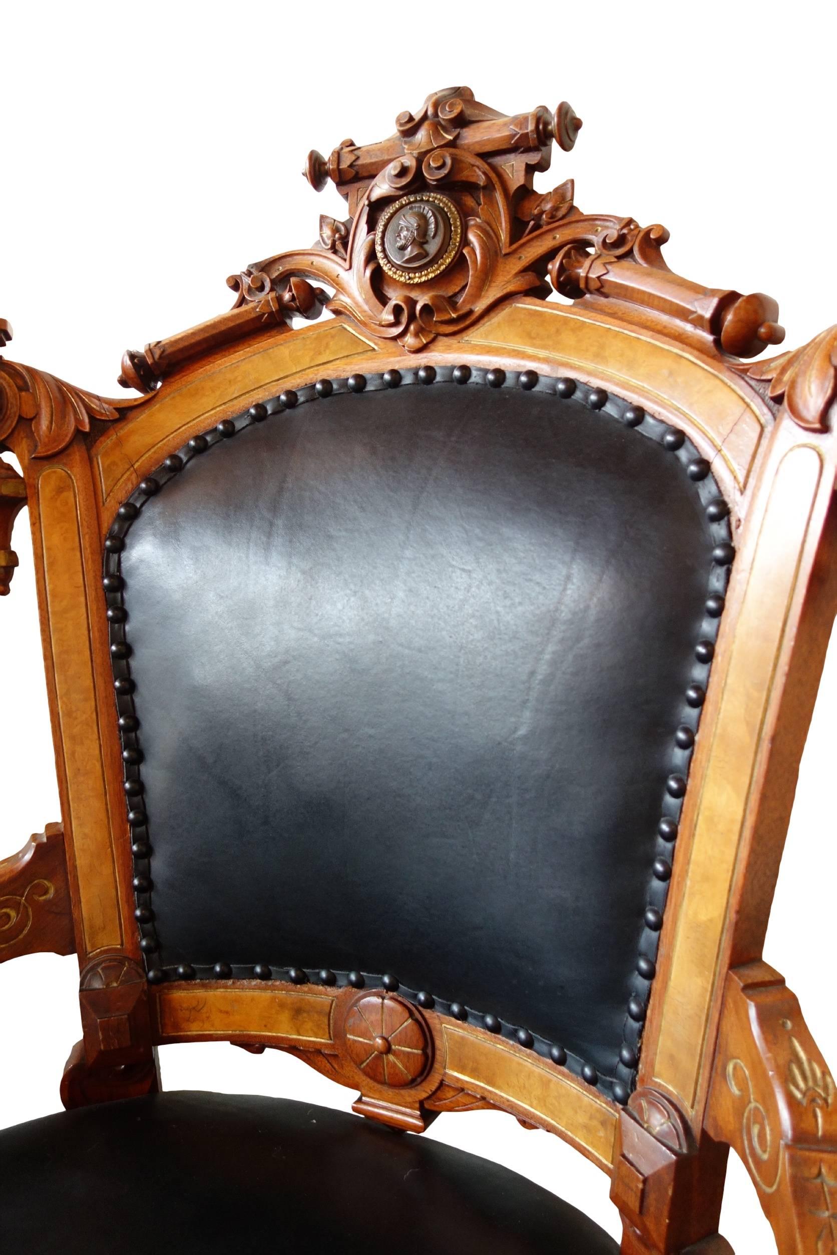 This is a pair of newly upholstered ornate John Jelliff Rococo Revival parlor chairs with walnut frame and signature Silhouette bust centered on the crest rail. One chair has front casters, the other does not. 

   