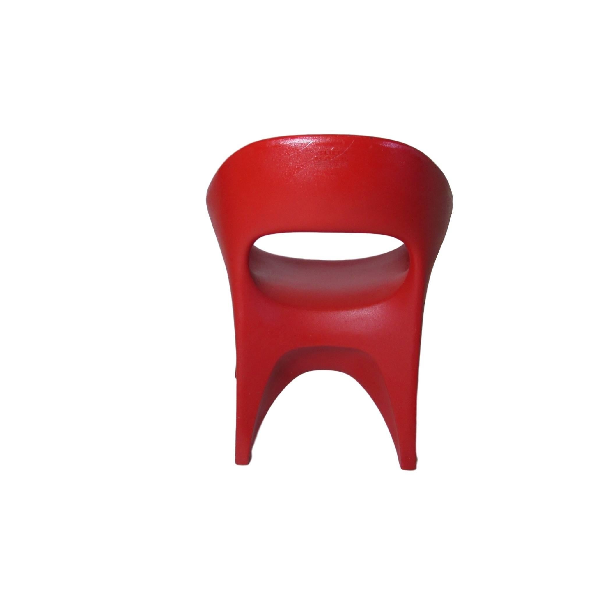Set of four atomic age rotocast plastic chairs by John Gale circa 1963.  Made from one molded piece, these chairs can be filled with sand or water to add heft.     Sharp and bold, these chairs are a real conversation piece.  On the back of each