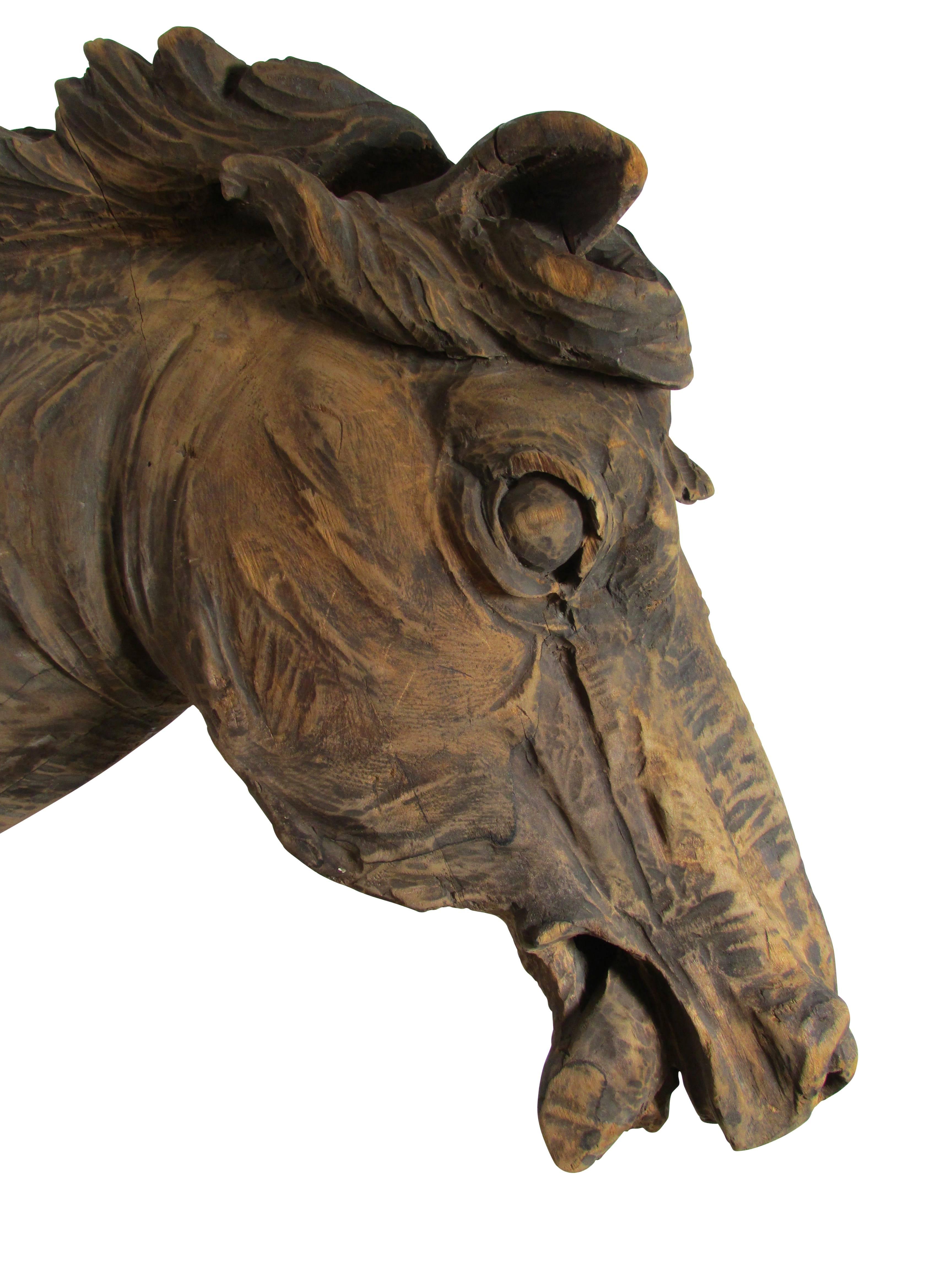 This is a fantastic one of a kind hand-carved horse head that was once mounted on the side of a barn.