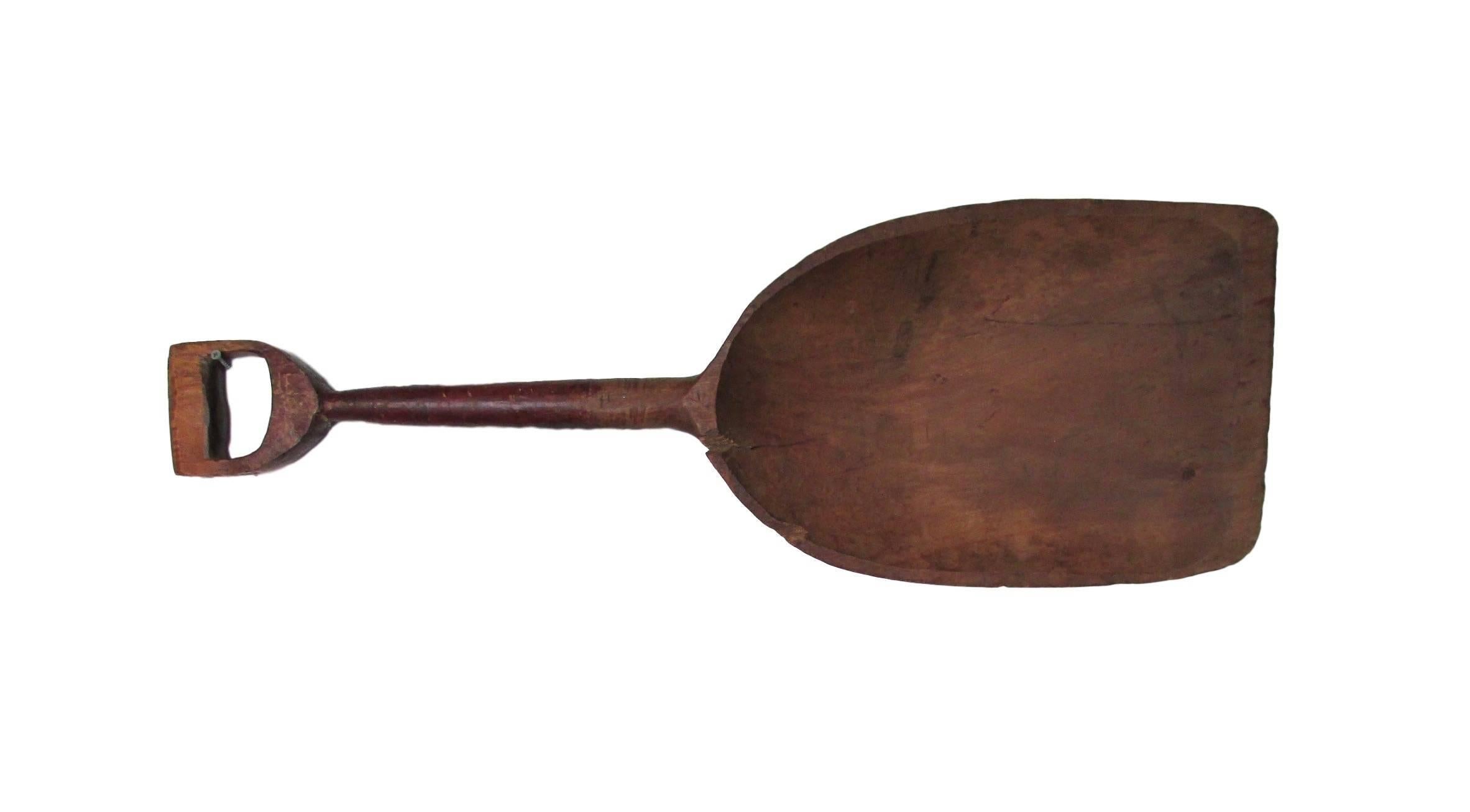 This is a wonderful hand-carved Primitive Folk Art shovel with original red paint on the handle.