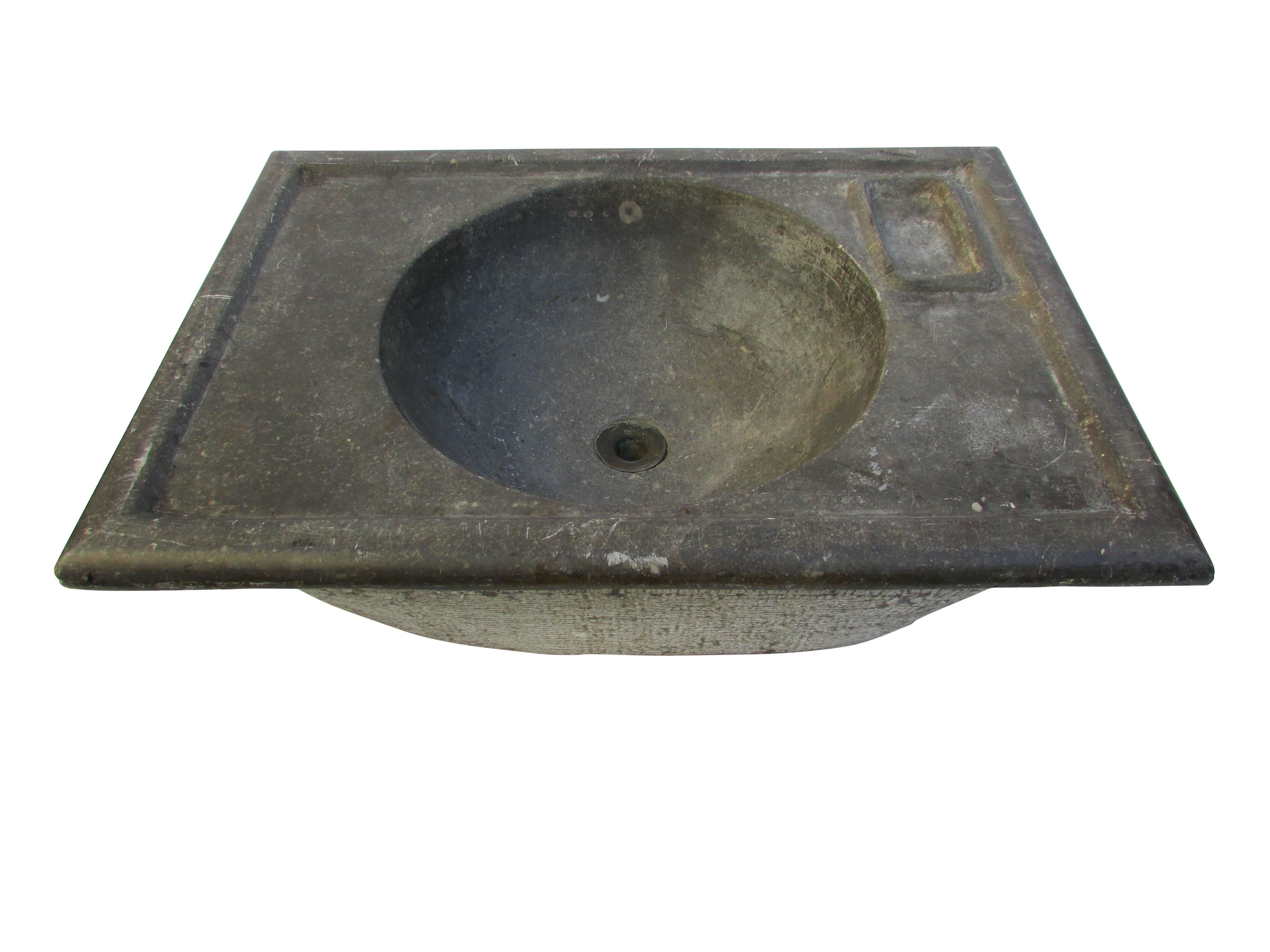 This is a beautiful turn of the century soapstone sink with soap dish and brass drain.