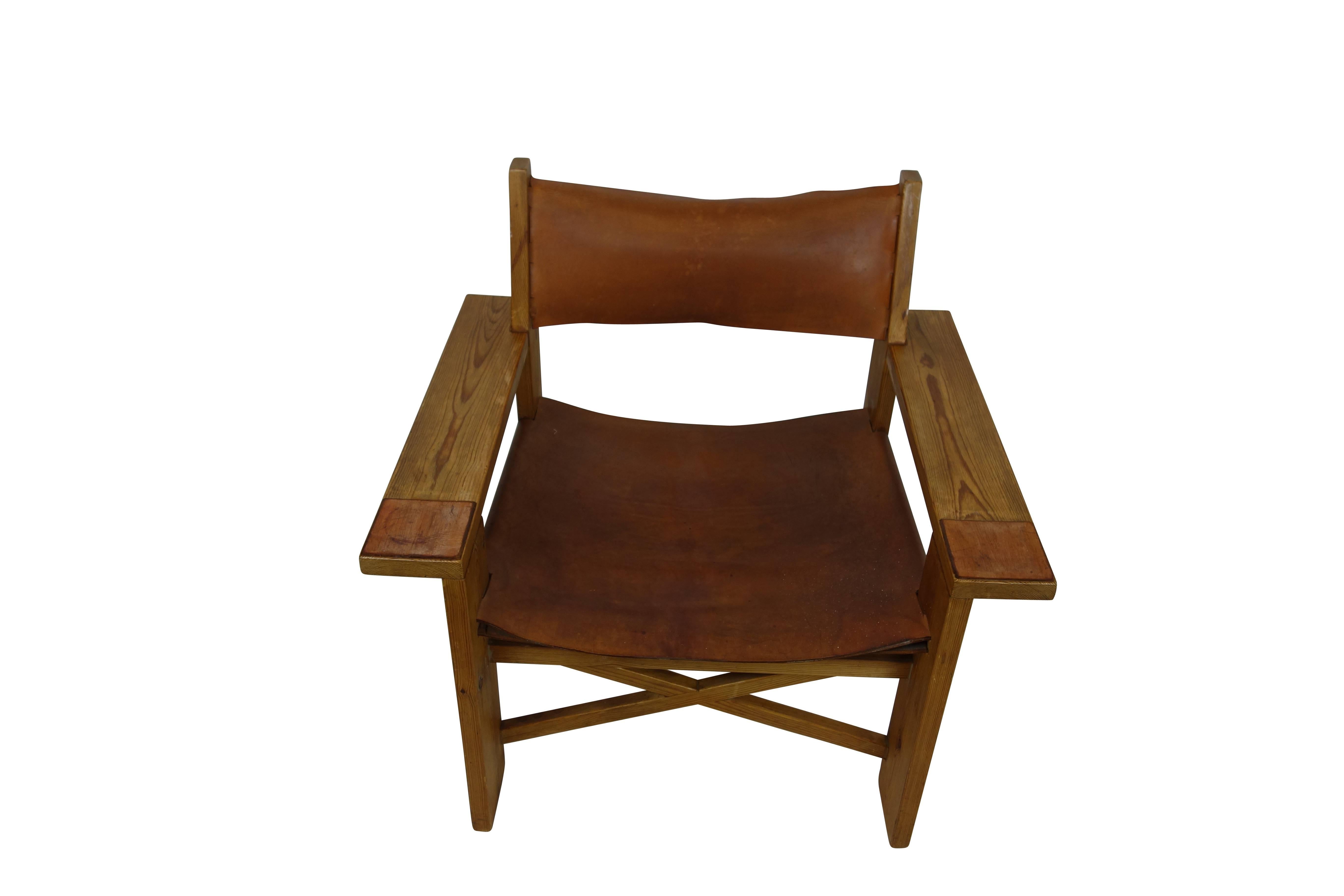 Vintage Danish camping easy chair in the style of Børge Mogensen with original cognac leather sling seat and coasters. Very uncommon, likely a prototype, circa 1950.