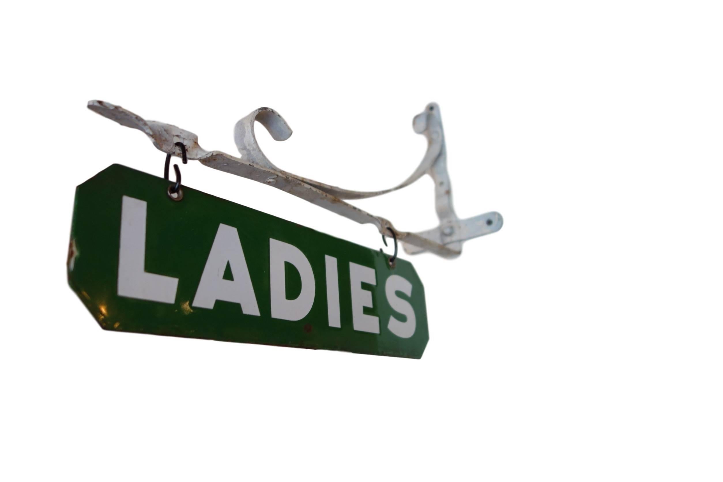 This is a double-sided porcelain 'Ladies' sign with its original wall mount bracket.
Total height 14