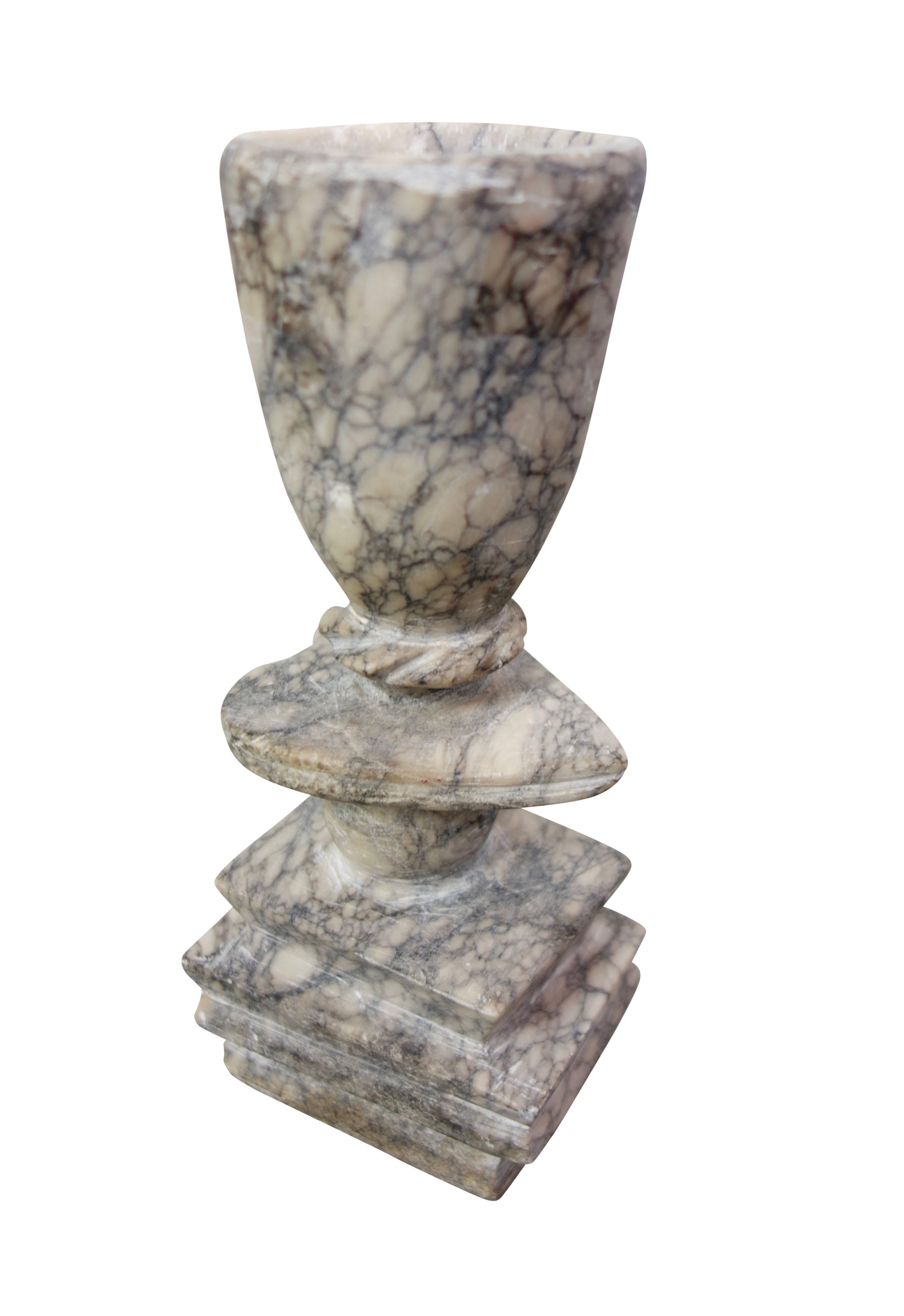 This is a lovely one of a kind hand chiseled marble goblet with a heart shaped stem, and a stack of books for the base. A perfect gift for a loved one.