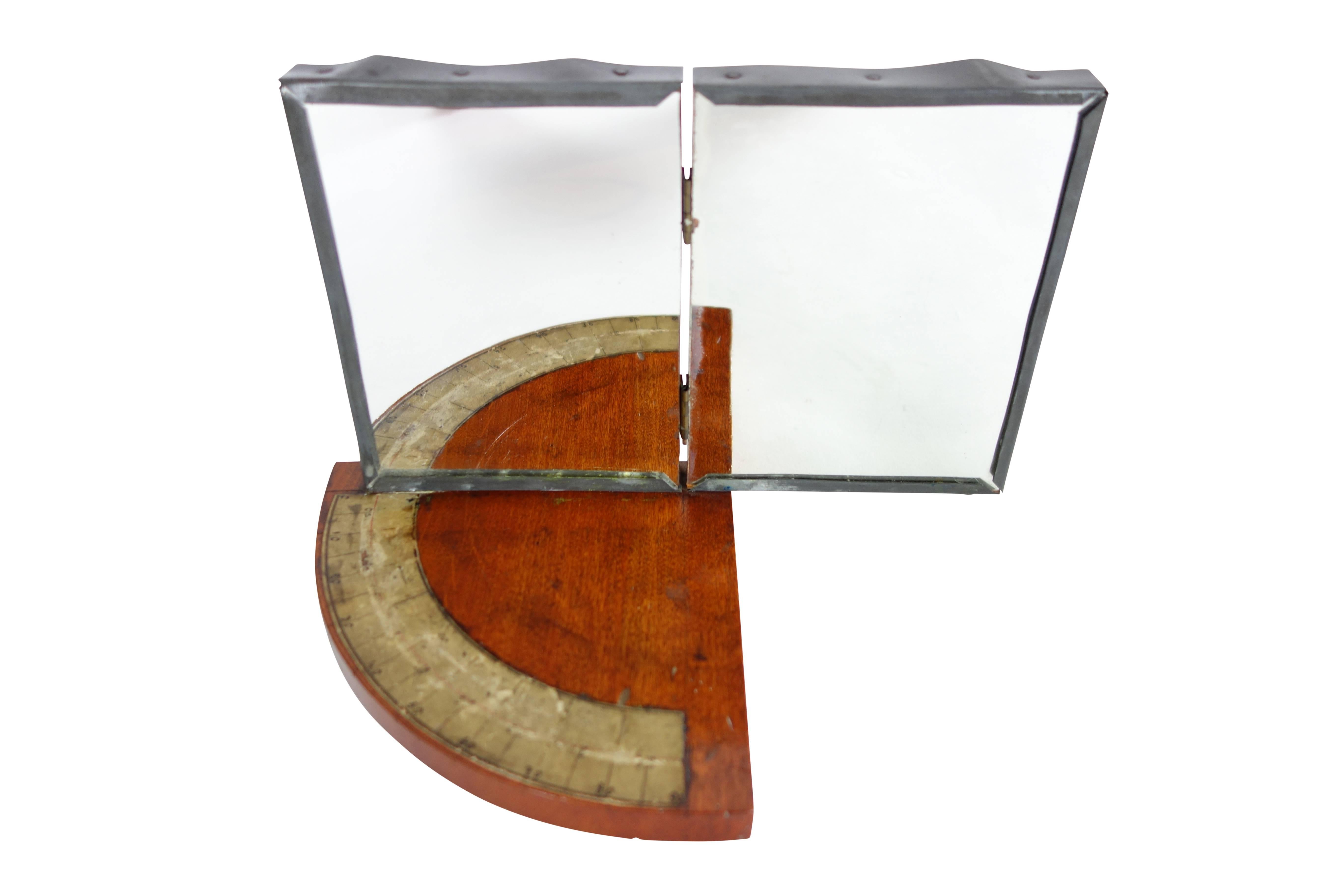 This is a fantastic and rare 19th century physics instrument used to measure the angle of light being reflected in the mirrors. One mirror is stationary, the other is on hinges allowing you to move it from a completely closed position to open. On