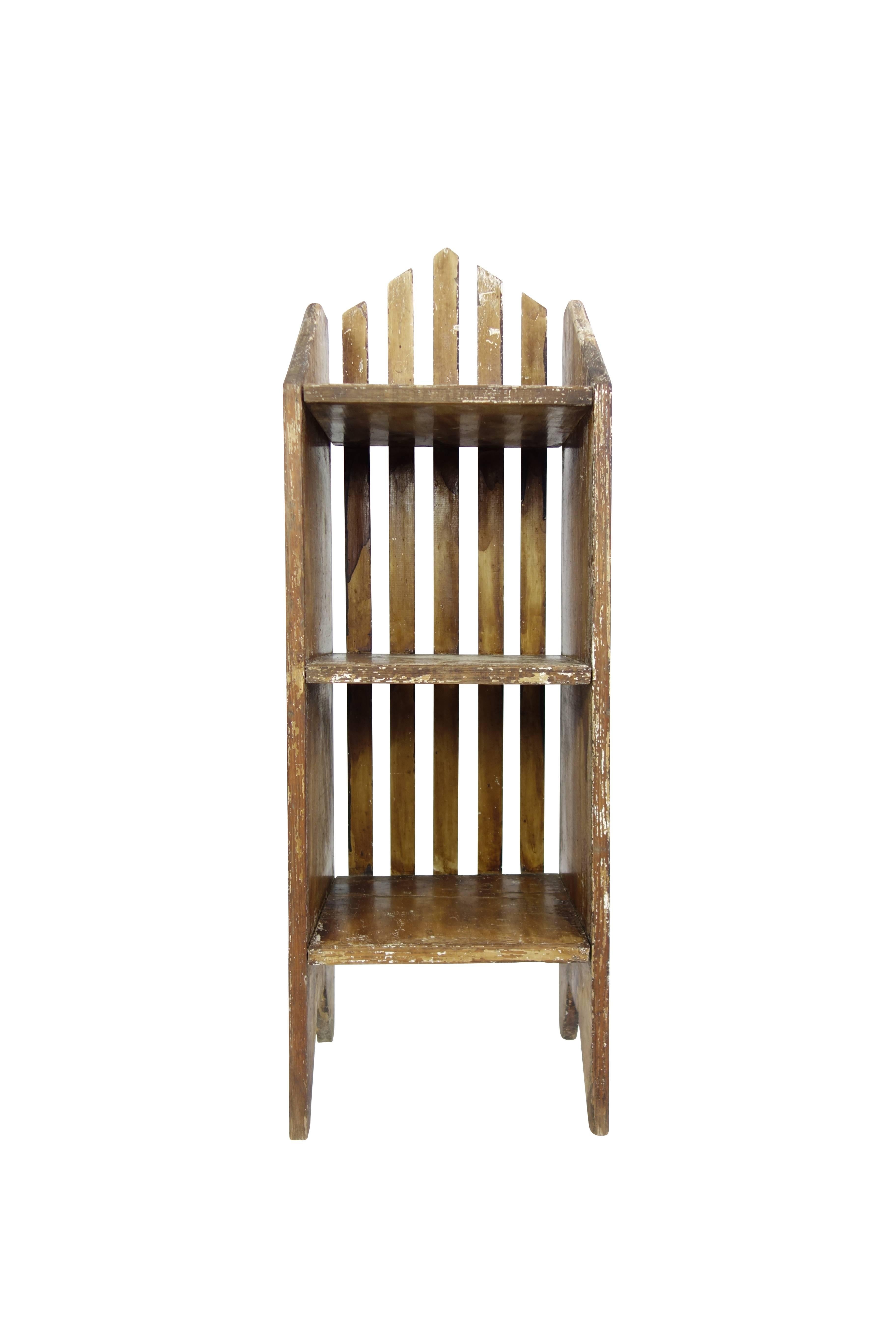 This is an unusual Primitive three-tiered shelf in its original paint.