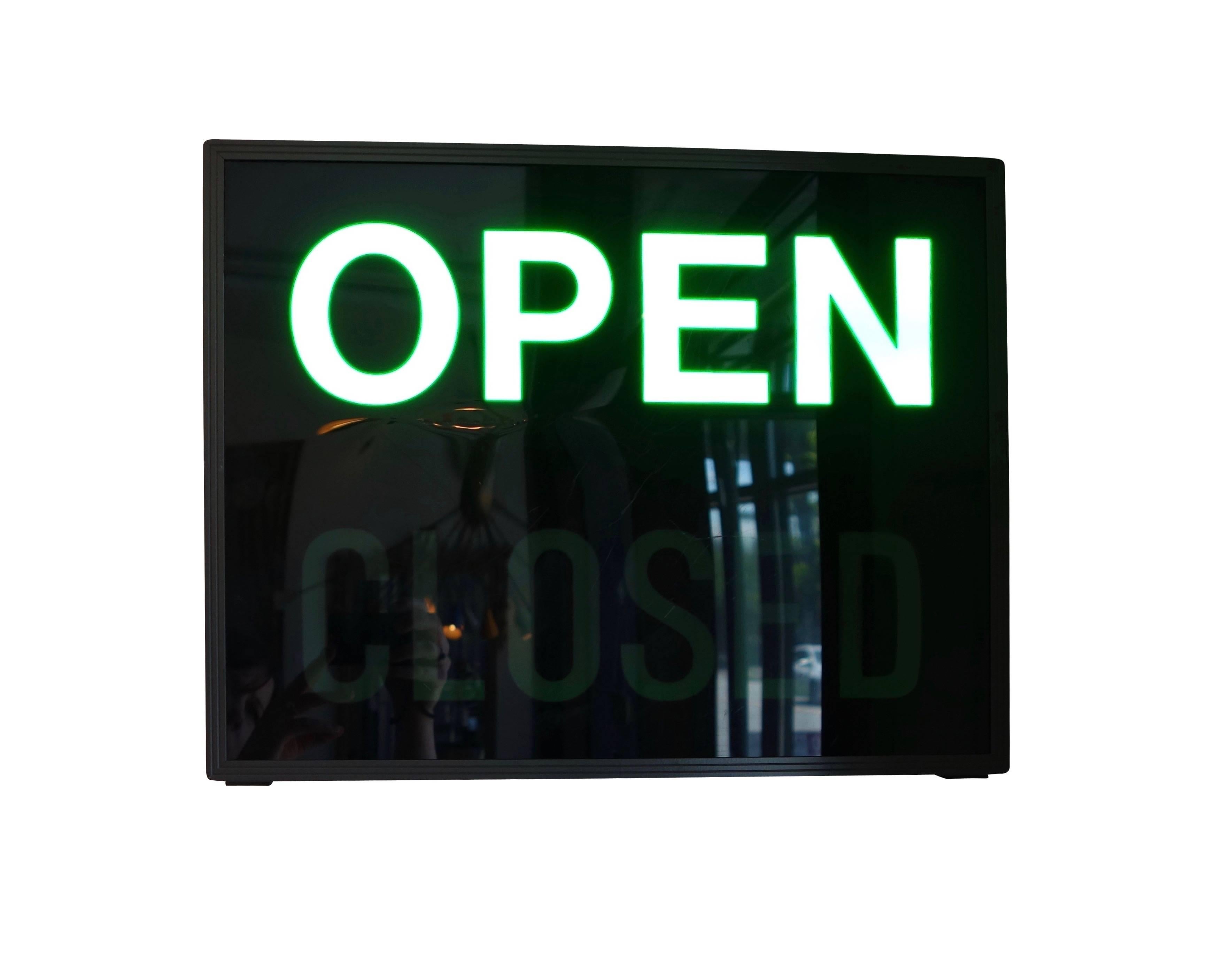 This is an illuminated 'Open/Closed' LED light box sign, circa 1980. A toggle switch on the sign allows you to switch from 'Open' to 'Closed' or turn the sign off completely.